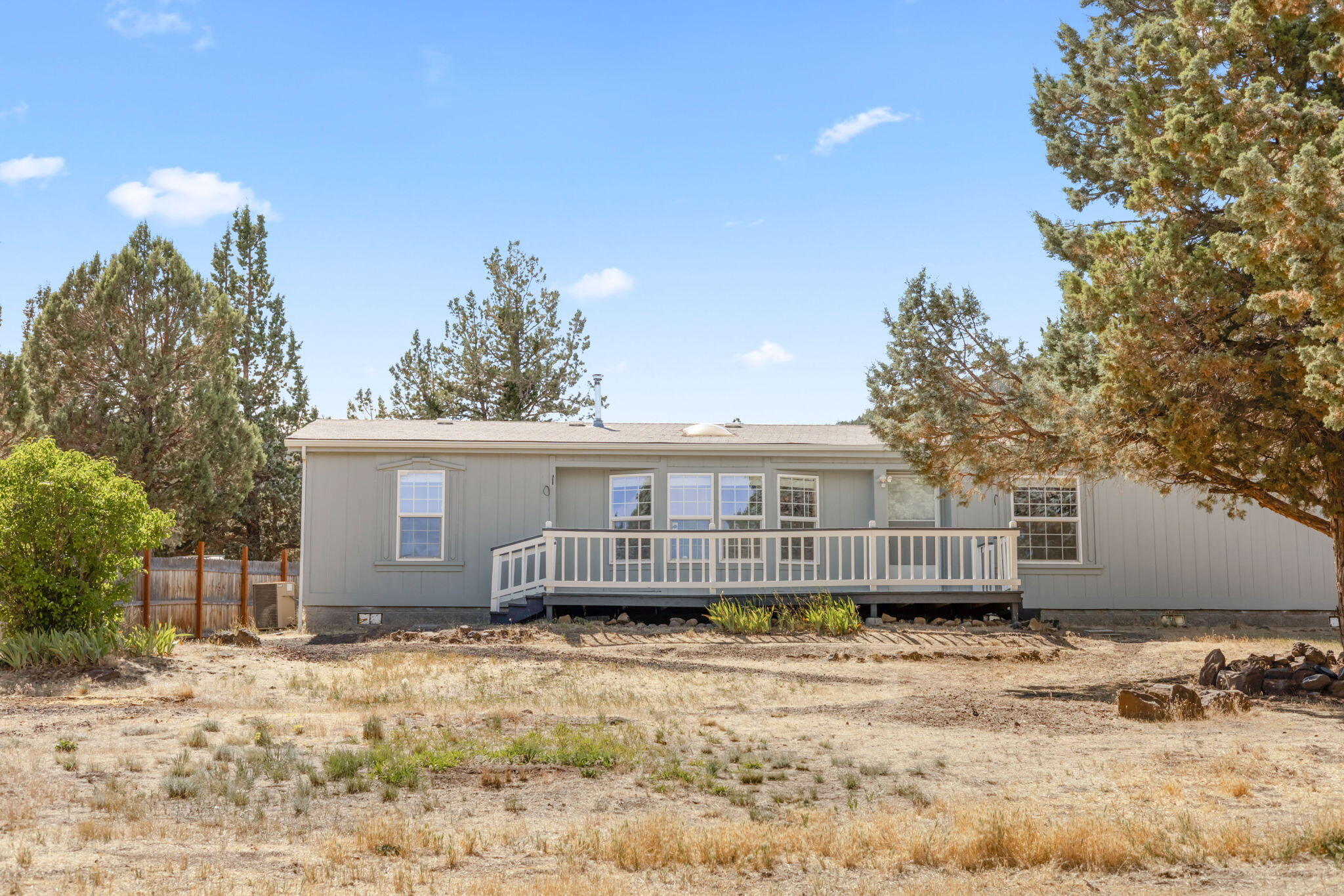 Escape to your own slice of Central Oregon just minutes from Prineville Reservoir and the renowned International Dark Sky Park. This 3 bedroom, 2 bath manufactured
home offers 1,711 sq ft of open-concept living on just over half an acre. Fresh interior paint and carpets installed in 2022 (just professionally cleaned) make it move-in
ready. Enjoy sweeping territorial views from the expansive back deck. The oversized detached 2-car garage is equipped with 200 amp power, and there are two powered
outbuildings plus ample space for RV parking. Community water and a standard septic system are in place. A peaceful setting with space to relax or explore.