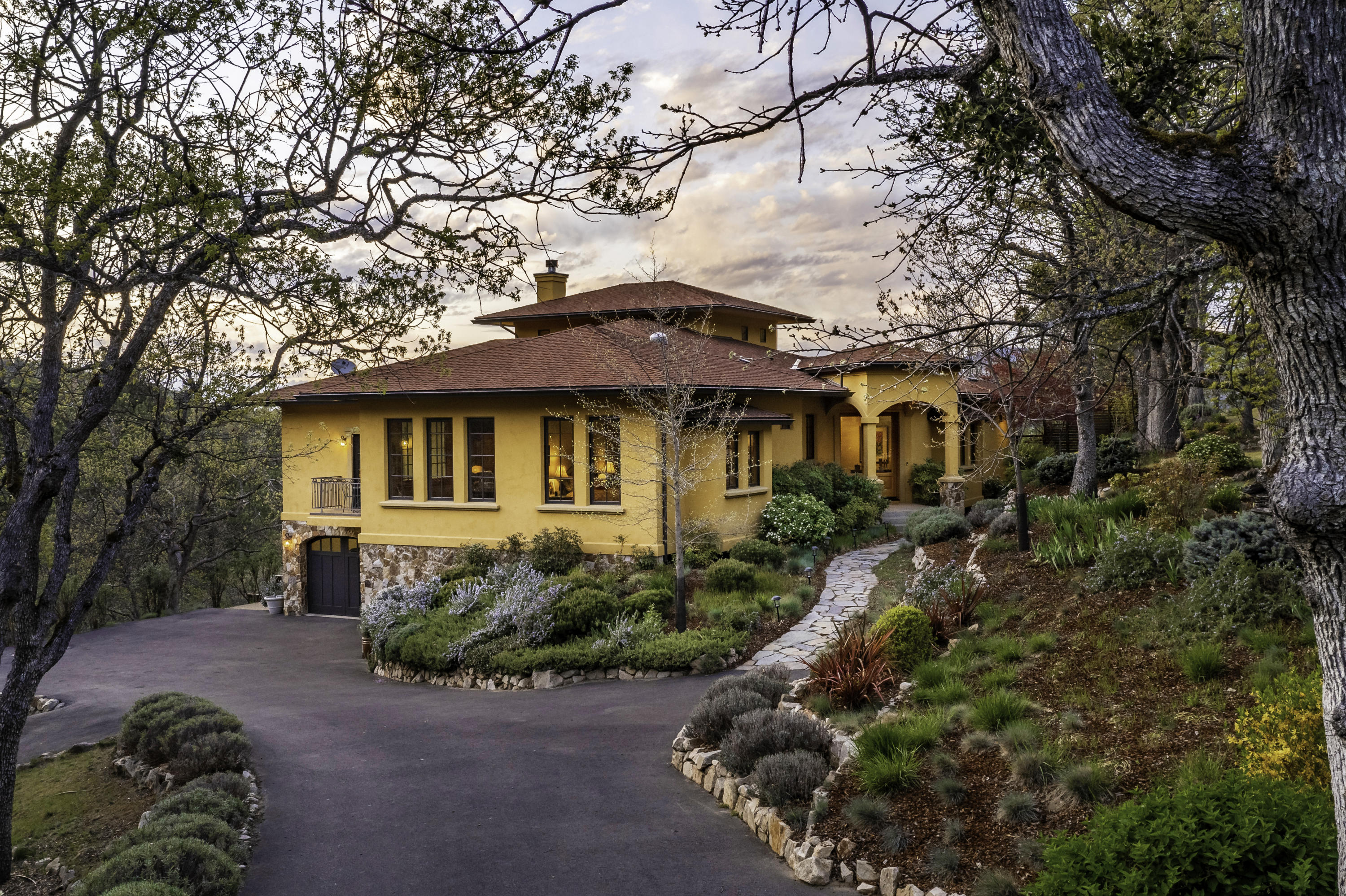 Contemporary 3,153 SqFt Tuscan-inspired home with additional 1,378 SqFt guest cottage and separate multi-purpose studio on 10 private acres, just 5 minutes from town! Park-like grounds feature elaborate gardens with meandering pathways, terraced rock walls, mature oaks, along with nearly 1,000 feet of seasonal creek frontage. Owner-built with renowned local designers and contractors to balance warmth and functionality with the highest caliber of construction and finishes. Top-quality materials include genuine stucco and stone exteriors, metal-clad Sierra Pacific windows, 50-year composition roof, limestone hearth, California chestnut floors, and vertical grain fir doors and trim. Stunning views from nearly every window of the home, especially from a tranquil master suite. Gourmet kitchen equipped with custom cabinetry, dual convection ovens, 6-burner natural gas range, and pantry. Inquire with agents for extensive documentation on all details of construction, surveys, and systems.