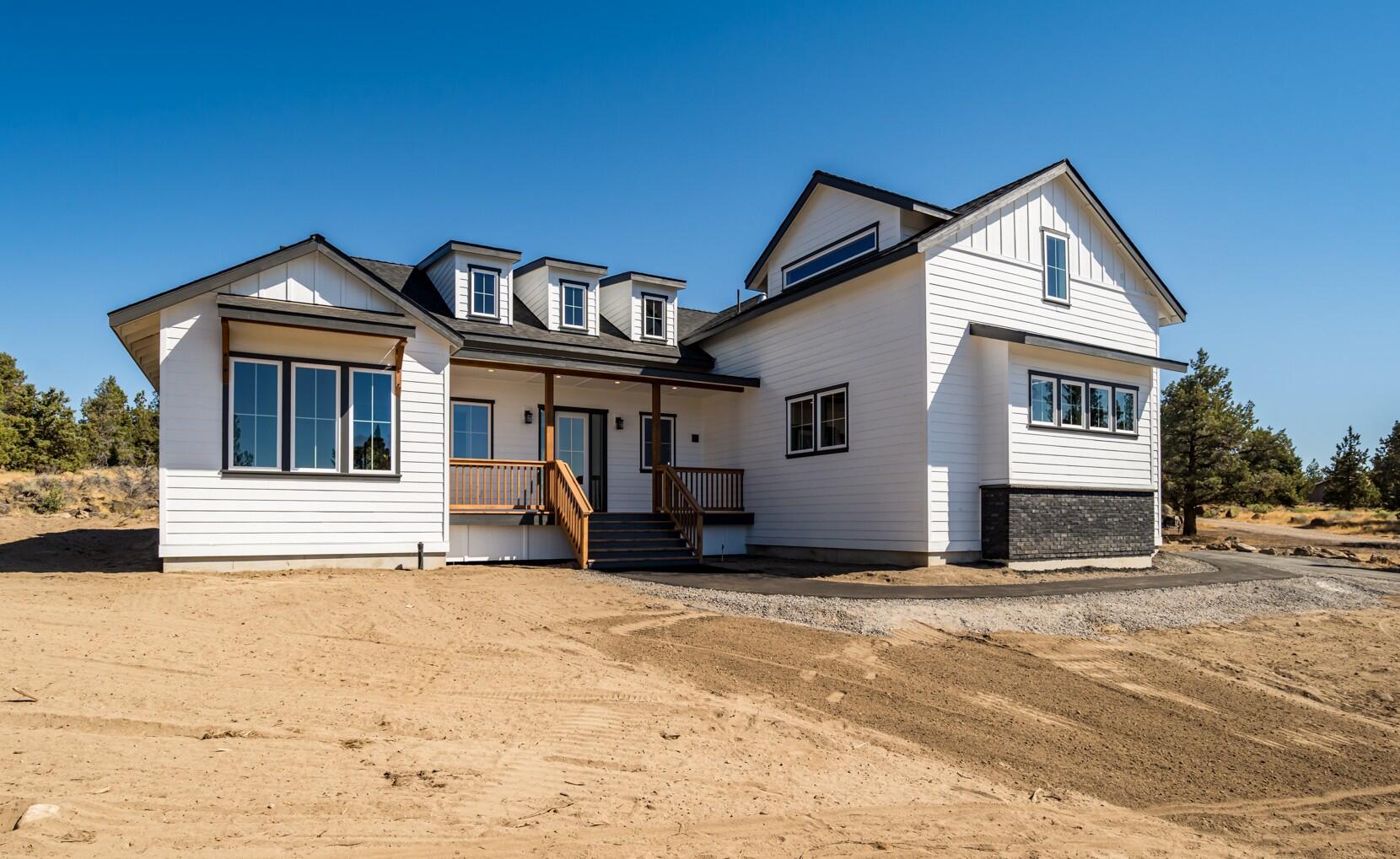 Looking for space and a brand new home in the highly desirable Tumalo area, just minutes from The Bite, Target and Costco on 2.4 acres - THIS IS IT!   The home has southerly views of Bend and the Paulinas, w/ mt. views from the flex room. Designed with both style & comfort in mind, the single-level floor plan features 3 bed/2.5 baths, an office, laundry room, and a versatile flex space. Inside, you'll find hardwood floors, quartz counters, and a chef-inspired kitchen that flows seamlessly into the open living area. Primary suite is a true retreat w/ a walk-in closet, dual quartz vanities, and a spa-worthy shower w/ full tile surround, fixed showerhead, handheld spray, and relaxing overhead rain feature. Enjoy quick highway access while maintaining privacy and room to expand w/ a shop or RV parking. With luxury finishes, incredible views, and a prime location, you'll enjoy the best of Central Oregon. Agent is related to Builder.