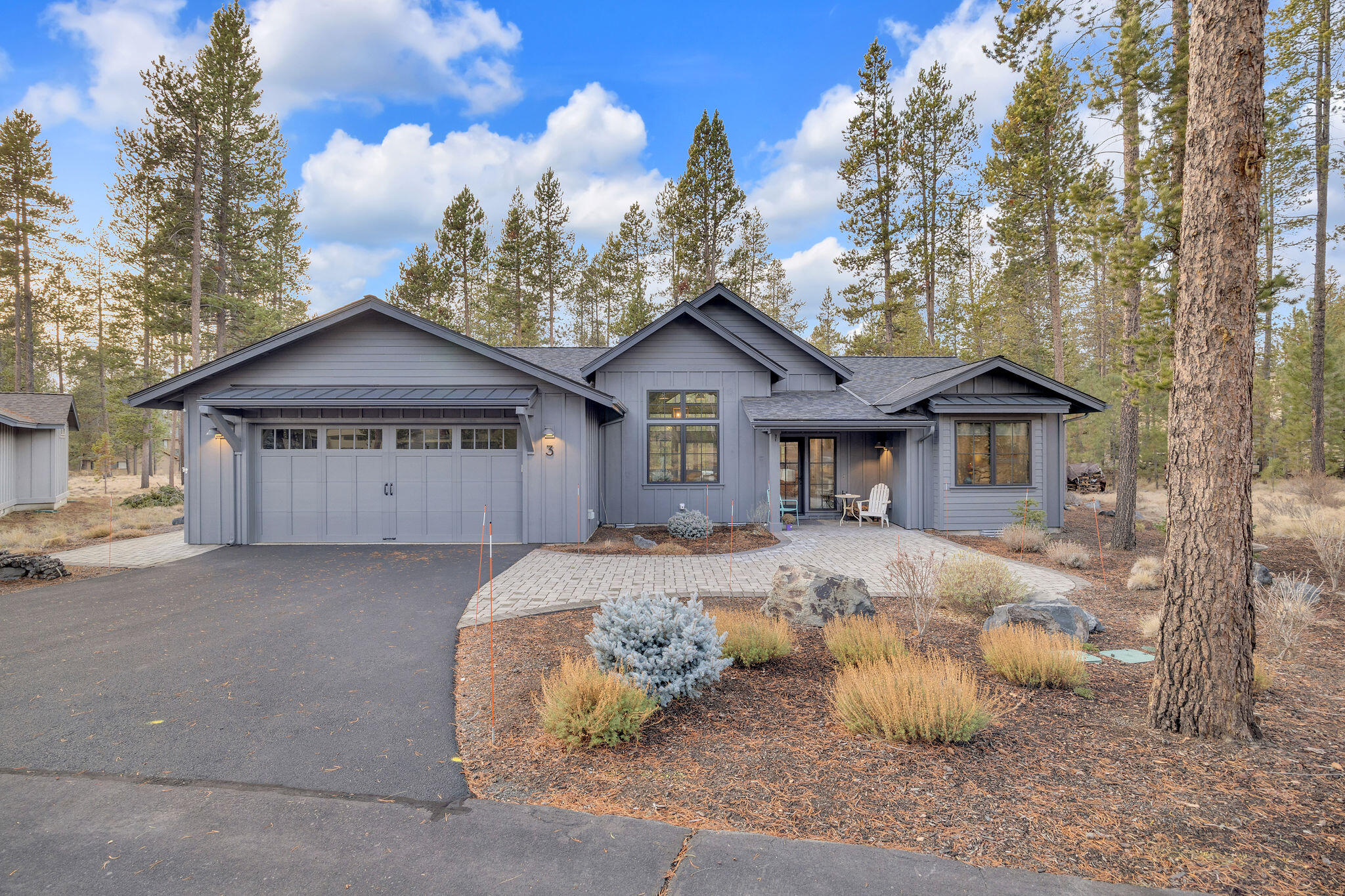 If you are seeking a Sunriver home that affords luxury, fine construction and yet provides a comfortable, Sunriver feeling #3 Summit Lane is the home you have been waiting for!  This single level home has a nice entry with paver stones, two primary suites on the main floor, interior walls are insulated, a finished attached over sized double car garage, wood burning fireplace in the great room with vaulted ceilings, Sonos speakers, nice separation for the bedrooms, two paver patio areas to enjoy the outdoors, beautifully landscaped lot that is super easy to maintain, 6 burner Smart Kitchen Aide gas range for cooking, Kitchen Aide appliances, soft close drawers, two Lazy Susan cabinets in the kitchen, convection microwave, remote control for middle window covering in the living room, gutters to protect the siding and just an overall great sense of value, comfort and warmth.  SHARC assessment is paid in full.