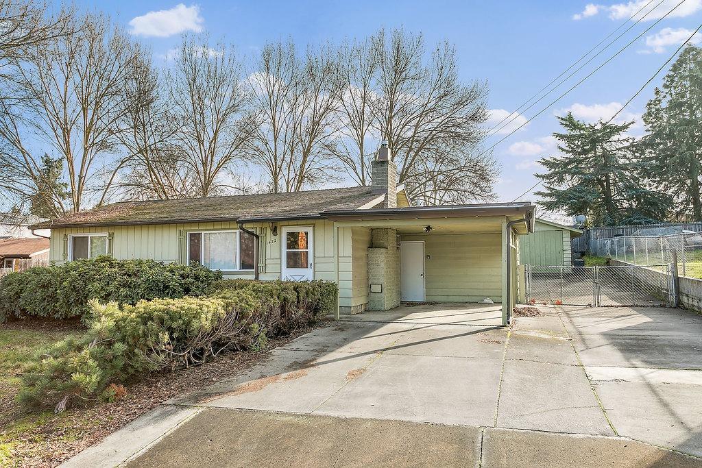 Nice home in great part of East Medford for first time buyer on .28 acre lot! Original hardwood floors in living room, dining area, hall and bedrooms. Gas fireplace in living room. Vinyl double paned windows. Oversized 1 car detached garage has additional shop area attached (total garage & shop space is 39x17 approx). Carport and additional RV parking 13x42. Covered patio. With over 1/4 acre lot you can possibly add an ADU, pool, additional sq ft to the home, an awesome garden or large shop.