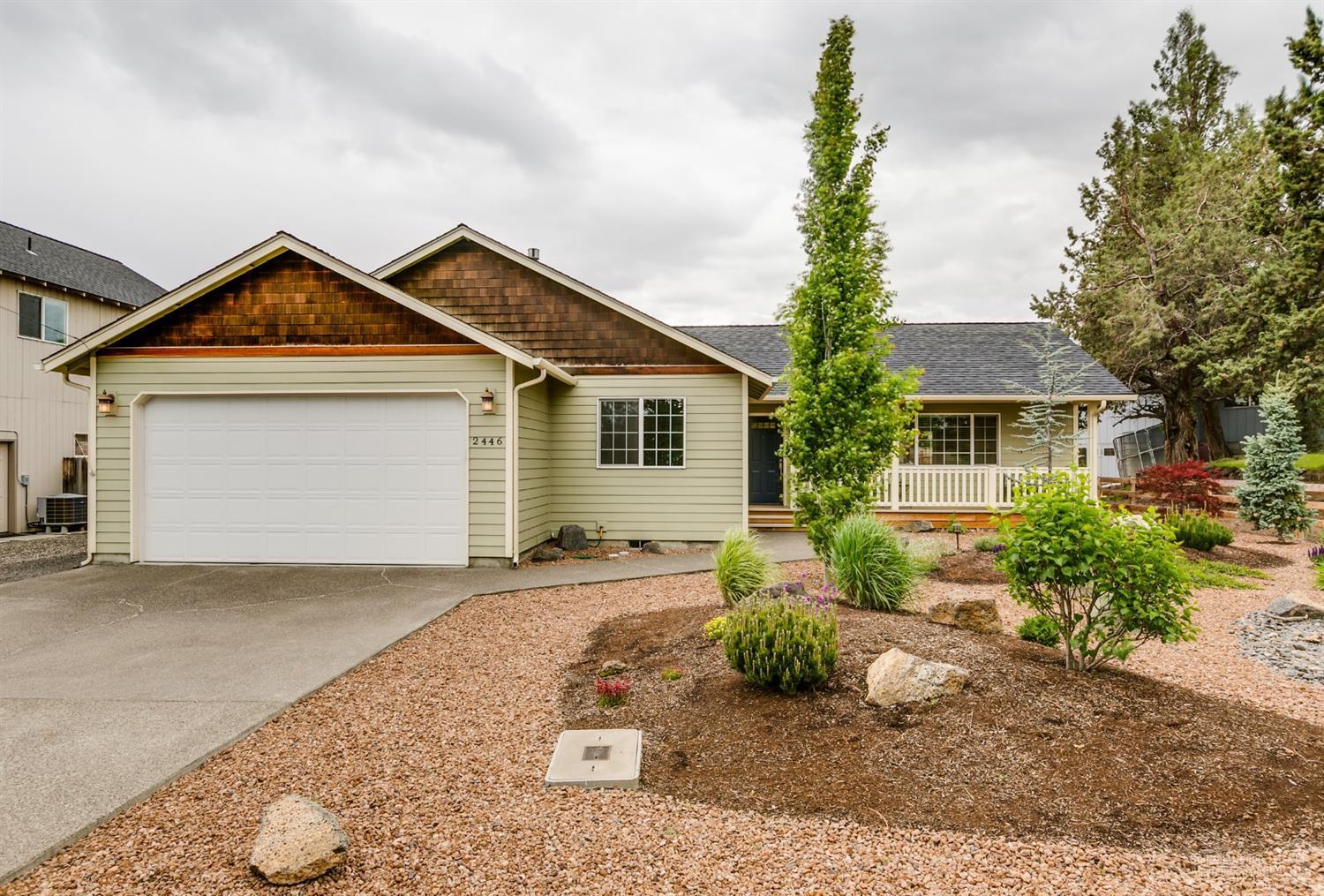 Impeccably maintained home is serene garden setting in SW Redmond! Pride of ownership is apparent throughout this 3 br, 2 bath home. Great room layout w/huge windows bring the beautiful landscaping in. Open kitchen w/central island & lg pantry, plenty of counter space & SS appliances. Corner gas fire place in the living room keep it cozy in the winter. Space to entertain year round w/covered patio just off the dining area. Master Ste offers a lg walk in closet, luxurious bath w/double sinks & walk in shower. New Quartz counters & backsplashes in both baths! Tiled floors & just cleaned carpets, this home is immaculate. Outside you'll find magazine worthy low maintenance landscaping that blooms all season long & irrigation systems in place. Huge back yard w/fruit trees, seating areas & fire pit. Storage shed makes a great work shop or hobby room. Gas forced air heat & A/C too! Adjoining lot also available.