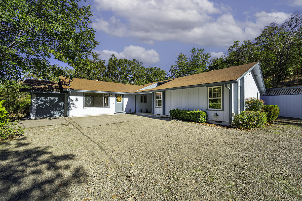 Better act fast! Great opportunity to own a spacious 2207 sf country home on 2.4 acres in great area on Old Stage Road! This single-level, comfortable home has wonderful space and loads of natural light. Privately situated surrounded by mature trees, the entry leads to a spacious living room with vaulted wood beam ceiling and woodstove. This room opens to a very large kitchen with big island with dining bar, tons of cabinets, storage and counter space. Very spacious open dining area with room for multiple tables or lounging chairs or couch and adjacent to 2 offices. Separate oversized family room is a huge bonus with room for gatherings, exercise or large projects. 3 bedrooms and total of 2 & ½ bathrooms. Workshop off the family room and separate outbuilding. Loads of off-street parking. Lots of potential to create beautiful gardens and outdoor living spaces and space for animals. We think this will go fast, don't delay!