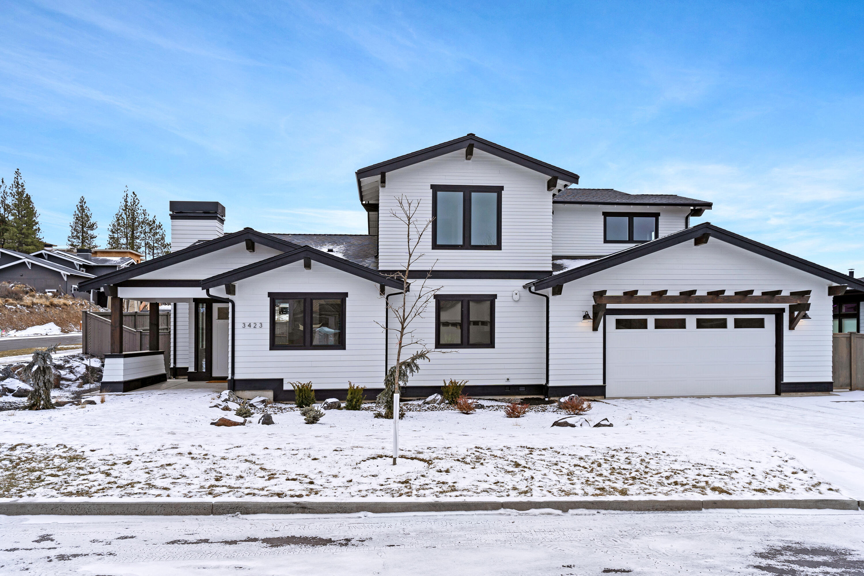 This newly constructed home by MCD Homes is located in the desirable Shevlin West neighborhood of Bend. The home offers 4 bedrooms and 2.5 bathrooms, with the primary bedroom on the main level. The primary bedroom's en suite bathroom features a walk-in shower, soaking tub, dual vanities, and a large walk-in closet. The main level offers an open concept living space, as well as a main level office and laundry room. The upstairs boasts three additional bedrooms, a full bath and bonus room. Perfect for entertaining, the home's large lot is an entertainer's dream, with a spacious covered patio off the living space and separate patio off the primary bedroom.