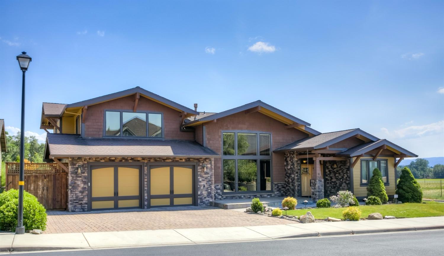 Stunning home in Echoes of the Ponderosa! This 3 bedroom and office, 2.5 bath boasts upgrades that other homes don't! Large, Fabulous main floor master with heated tile, jetted tub, towel warmer, oversized slate shower, gorgeous granite, slate floors and a professionally designed master closet. Soaring ceilings and huge beams in the open living, dining, kitchen area with massive windows and a ceiling height stone fp. Island kitchen with professional Viking SS appliances, pantry, large utility room. Good sized bedrooms, huge bonus room with wet bar and room for a pool table and a media area. Outdoor living is resort-like with a built-in spa, lagoon pool with a gorgeous waterfall feature, outdoor kitchen, firepit, raised beds and more. 3 car garage with built-in professionally installed storage areas. Open space behind and views of the surrounding mountains make this a home you won't want to miss!