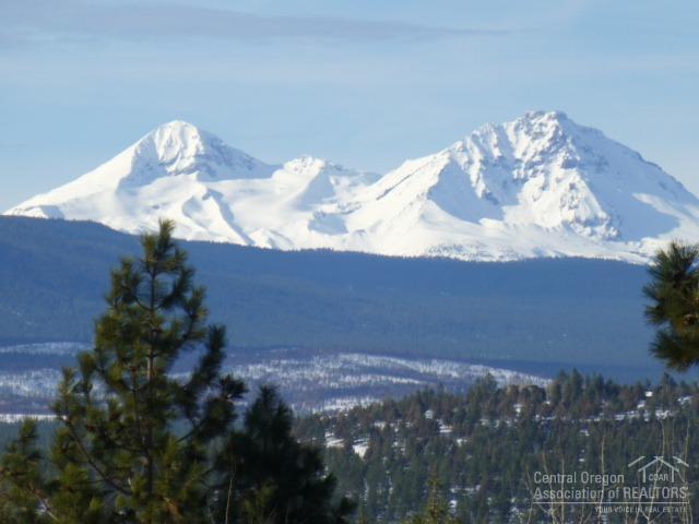 Stunning large home site (.81 acre) with panoramic Cascade Mountain views, gentle up-slope and beautiful evergreen trees. Located in one of Bend's premier Northwest neighborhoods, Awbrey Butte offers parks, tennis courts, curbs and sidewalks. Easy access to downtown Bend, schools, shopping, golf and hiking or biking trails. This is a neighborhood of fine homes. Build your dream house and enjoy gorgeous sunrises and sunsets all year round!