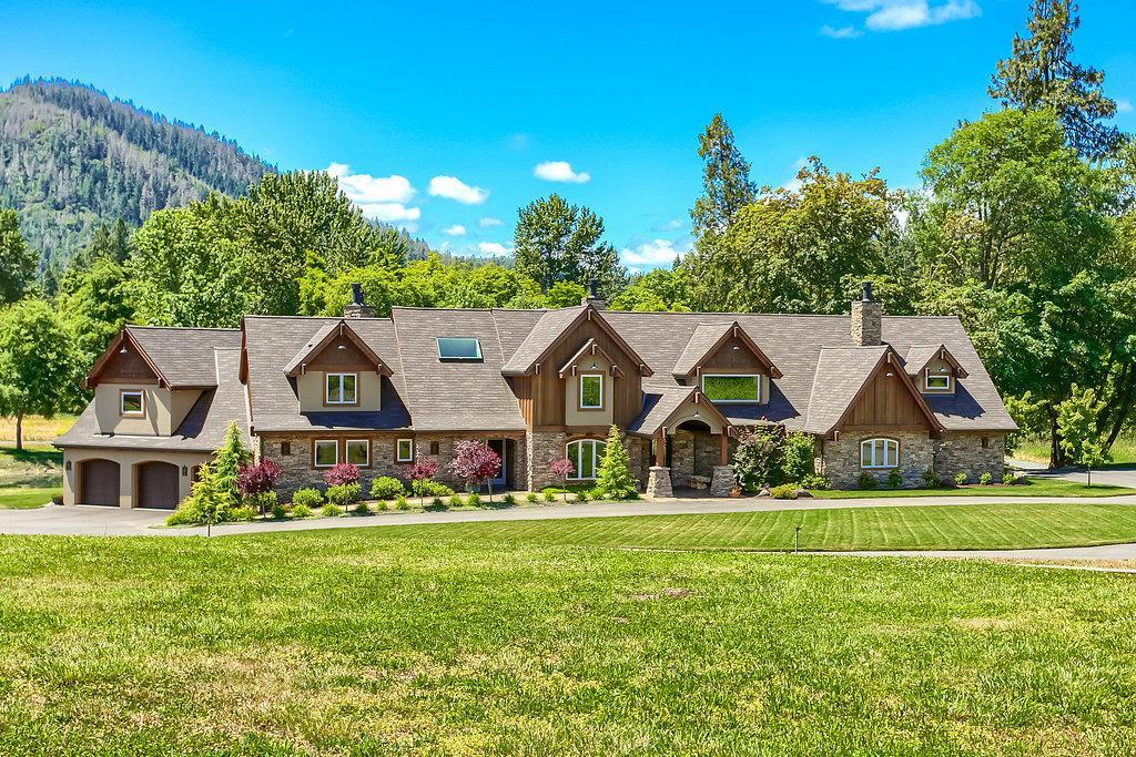 NO RESERVE AUCTION! Exceptional Applegate River Estate. Rare Opportunity to Own an Alluring Wine Country Estate at Your Price. The Main Home Offers Unparalleled Craftsmanship; 6,359 sq. feet, Five Bedrooms (3 Ensuite), an Office, Six Bathrooms & Three Custom Fireplaces. Ample Luxury & State of the Art Features; Calcutta Marble, Thermador Appliances, Distressed Hickory Hardwoods, Surveillance Systems, Geothermal, Solar, Generator & More. Separate Guest Quarters Offers 2,533 sq. feet, Four Bedrooms & Three Bathrooms. Incredible Two Story Approx. 10,000 sq. ft Shop with Additional Guest Quarters. There is also a Multi-Purpose 583 sq. ft Building. Mature Vineyard; Approx. 4 Acres, Approx. 37 Fruit Trees, Irrigated Pasture Land for Animals or Planting, Garden w/Raised Beds, Decorative Pond with Waterfall Feature that Cascades into a Huge Pond. Gated & Private. Quite Simply, Breathtaking. Please View Virtual Tour for Additional Photos.