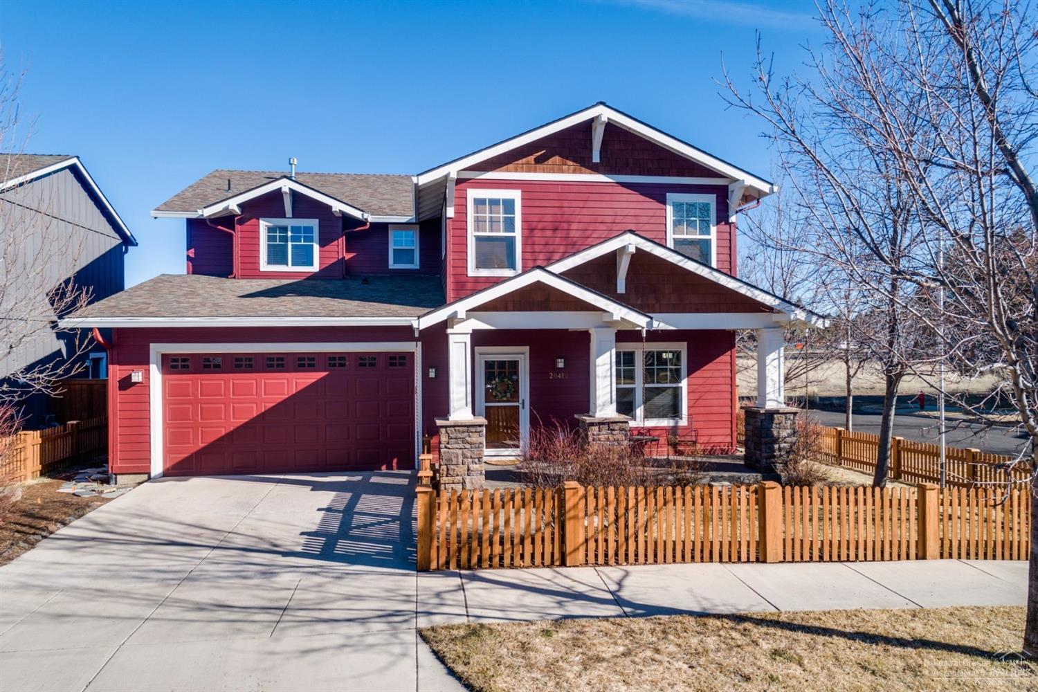 Charming 4-bedroom, 2-1/2 bath home on a light and bright corner lot in the desirable Southeast Bend neighborhood of Stonehaven. The private fenced back yard with its deck and paver patio is perfect for entertaining; it accesses the picket fence enclosed front yard and entry gate to give everyone a place to play. This former model home features a 2-car garage; lots of wood finish carpentry features such wainscotting, crown moldings, and beam/ceiling accents; wood floors throughout; built-in bookcases and stone fireplace in family room, and a lovely master suit with fireplace and a spa-like master bath with travertine tile floors, walk-in shower, soaking tub, and his-and-hers walk-in closets. The lovely kitchen is the heart of the home with solid granite counter tops, stainless appliances, and a pass-through butler pantry with ample storage and a beverage fridge. This home has been meticulously cared for and is move-in ready.