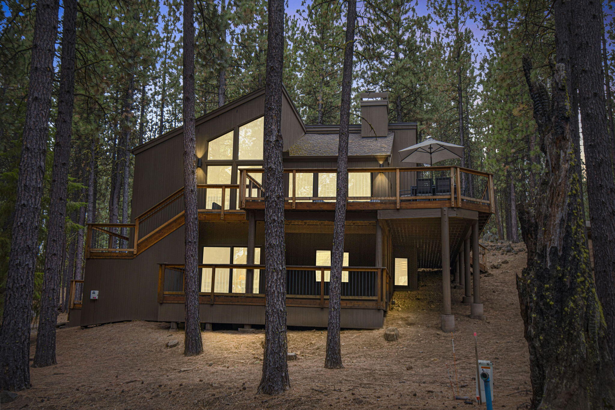 From GM249 there are conveniently easy paths to both Glaze Meadow Golf Shop and Glaze Meadow Rec Center.  The home features a floor plan designed for the active Black Butte Ranch lifestyle. Upper level offers an open concept main floor, with 2 primary bedroom suites. Remodeled kitchen that flows into the dining area, and the great room, with a wood stove, and birds-eye views of the natural, serene beauty. The views, including some of the GM 1st fairway and wildlife, continue from the wrap around deck, with choices for different sun exposures and star gazing, The lower level has access from the garage, a convenience for arriving guests. The  good sized bonus room, with a covered deck, is inviting to children for indoor and outdoor play areas.  Also, it is  a comfortable gathering area for adults who like to play, watch important sports events, or just relax. There are 2 additional bedrooms and a full bathroom. Enjoy 2 championship golf courses, tennis/pickleball courts, 6 pools