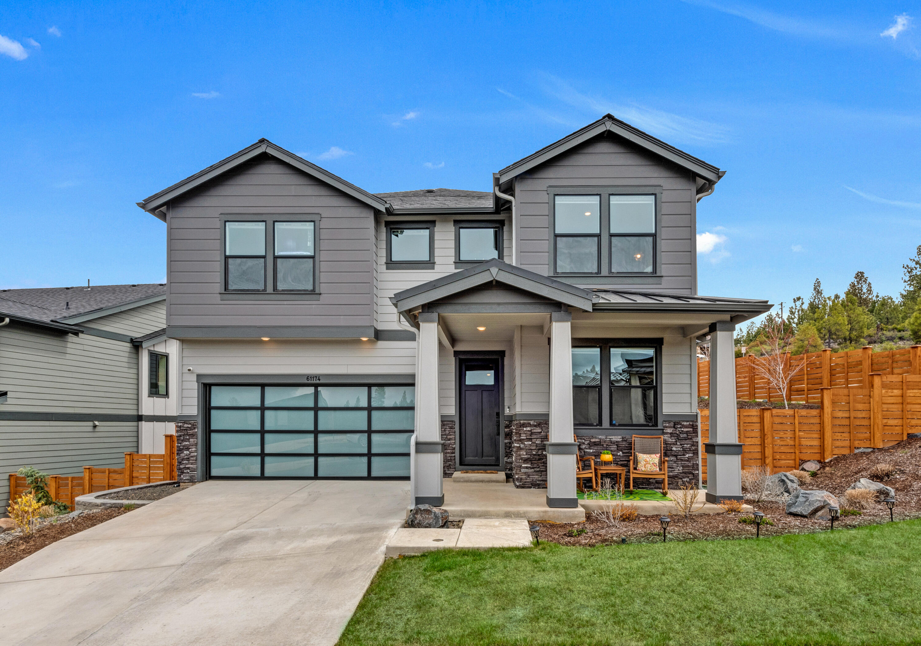 Indulge in the ultimate lifestyle, only steps from the Deschutes National Forest and its extensive trails systems yet only a short drive to Bend's best shopping and dining. Purchased as a second home in 2022, meticulously maintained and with many recent upgrades, including high-end engineered wood flooring, designer light fixtures and new carpet throughout. Inside, the open floor plan is bathed in natural light, creating a warm and inviting atmosphere. The gourmet kitchen features an oversized island, sleek tiled backsplashes and an expansive pantry. The bonus room provides a peaceful retreat with stunning mountain views. Unwind in the lavish primary suite with dual vanities, a soaking tub, and a tiled shower. Situated on a generous corner lot with no rear neighbors, a private back patio, and tasteful landscaping. Revel in the boundless outdoor recreation opportunities, with direct access to the Deschutes River, Phil's Trails, and Mt. Bachelor.