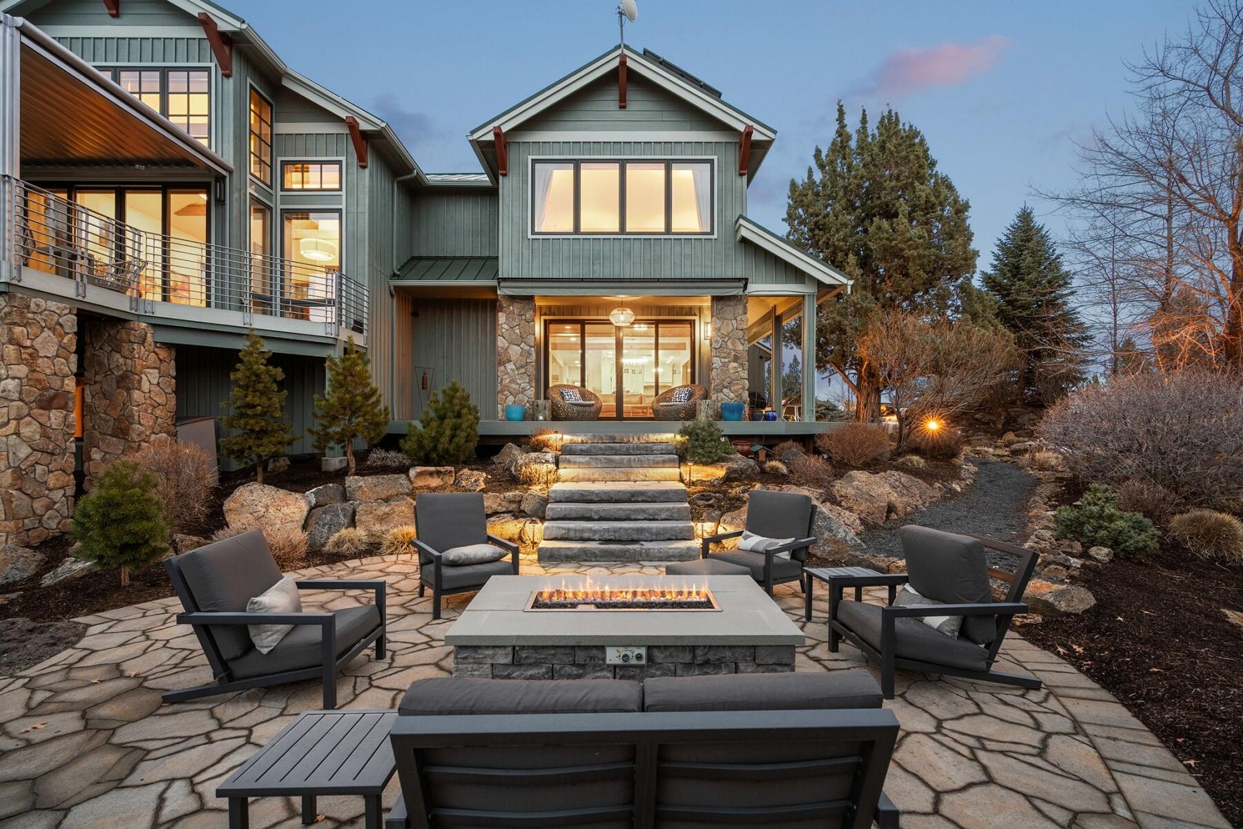 This stunning 4,832 sq ft contemporary estate, exquisitely remodeled in 2013, is a true sanctuary on 33 acres (22 irrigated). Designed for luxury and comfort, it features 5 spacious bedrooms, 4.5 elegant baths, and high-end finishes, including reclaimed Douglas fir flooring, exposed beams, and artisan-crafted Hubbardton Forge lighting. The gourmet kitchen boasts a 6-burner Viking range, walk-in pantry, and Miele double ovens. Enjoy breathtaking mountain views, a private waterfall, and beautifully landscaped outdoor spaces with a hot tub, fire pit, and outdoor fireplace. The 900 sq ft casita is perfect for guests or a home office, while the 750 sq ft barn and 800 sq ft shop provide ample storage. An equestrian's dream, it offers cross-fencing, paddocks, a large shelter, and a 22-zone Rain Bird system for lush pastures, currently used for hay production. Geo-thermal heated floors and 44 solar panels ensure efficiency. Just 40 minutes to Mt. Bachelor, this is Bend living at its finest!