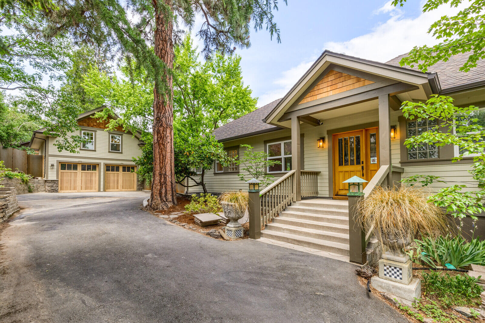 A hidden gem, close to town, views galore & completely renovated. The main 2362 sf house boasts hardwood floors, custom cabinetry, built-ins, tile & elegance throughout. The main level offers a delightful eat-in kitchen, complete w/pantry, 4 person eating nook, soapstone counters, apron sink, mahogany island, professional ovens & SS appliances. A large dining area, living room w/built in bookcases, fireplace & cozy nooks, laundry/mud room, 2 baths and 2 bedrooms
complete the spacious design. Downstairs is an expansive master suite & bath w/radiant heated floors, soaking tub, walk in closets & large window doors that open to the hot tub & rose garden. An additional 712 sf living space w/ 1 bed & 1 bath is located above the 2 car garage w/a separate entrance. The unique custom features & materials are not to be missed! Outside are extensive decks, stone terraces, paths to the gardens & raised beds, fruit trees, grape arbor, large flat fenced yard & charming places to take in the beauty.