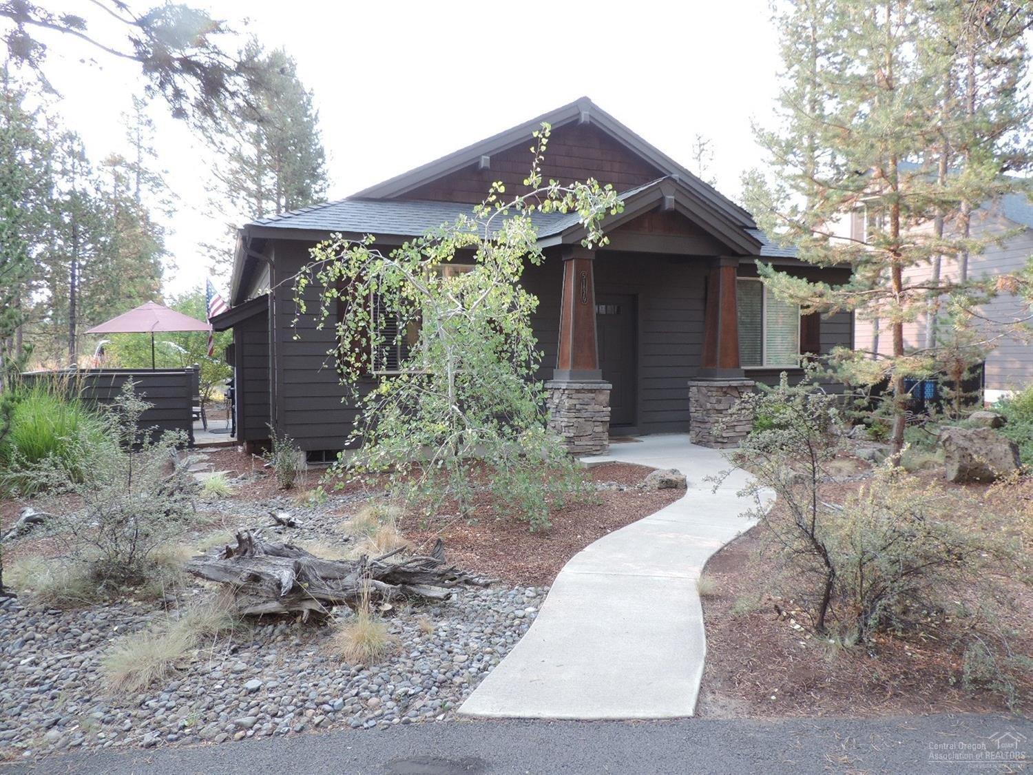 Beautiful naturally landscaped yard & uber clean home in private neighborhood near the clubhouse/fitness room, outdoor sport court & miles of trails, but close to town & schools. Perfect for a plush vacation home base or full time resident who doesn't need a large home. Enclosed patio, gas fireplace w/hearth & mantle, hickory hardwood & cabinets. A/C! 3 garden beds w/sprinklers! City water/sewer, natural gas heat & HW, paved & maintained roads. Off road public lands nearby to bike & run the pooch!
