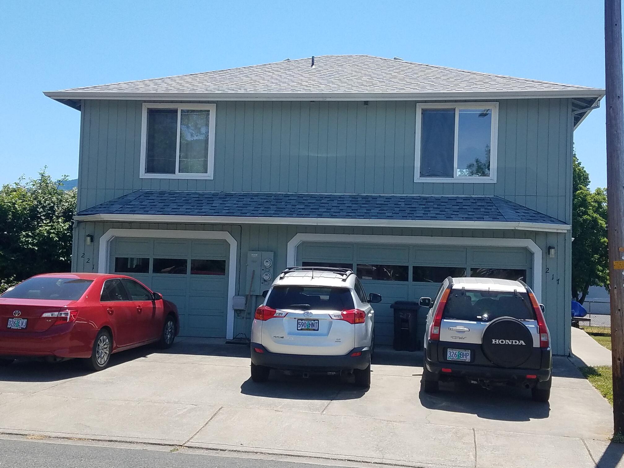 Best duplex scenario: live in lower (owner unit) and rent upper unit. Very clean units located conveniently in NE Grants Pass. Owner built duplex in 1994. 1404 sqft 3 bedroom 2 bath owners unit with 2 stall garage. 1037 sqft upper unit is 2 bedroom 1 bath with 1 stall garage. Great location near I-5 access. Quiet residential street with mostly single family homes. Both units have electric HVAC systems. Double garage for larger unit features 8 x 10 storage room.