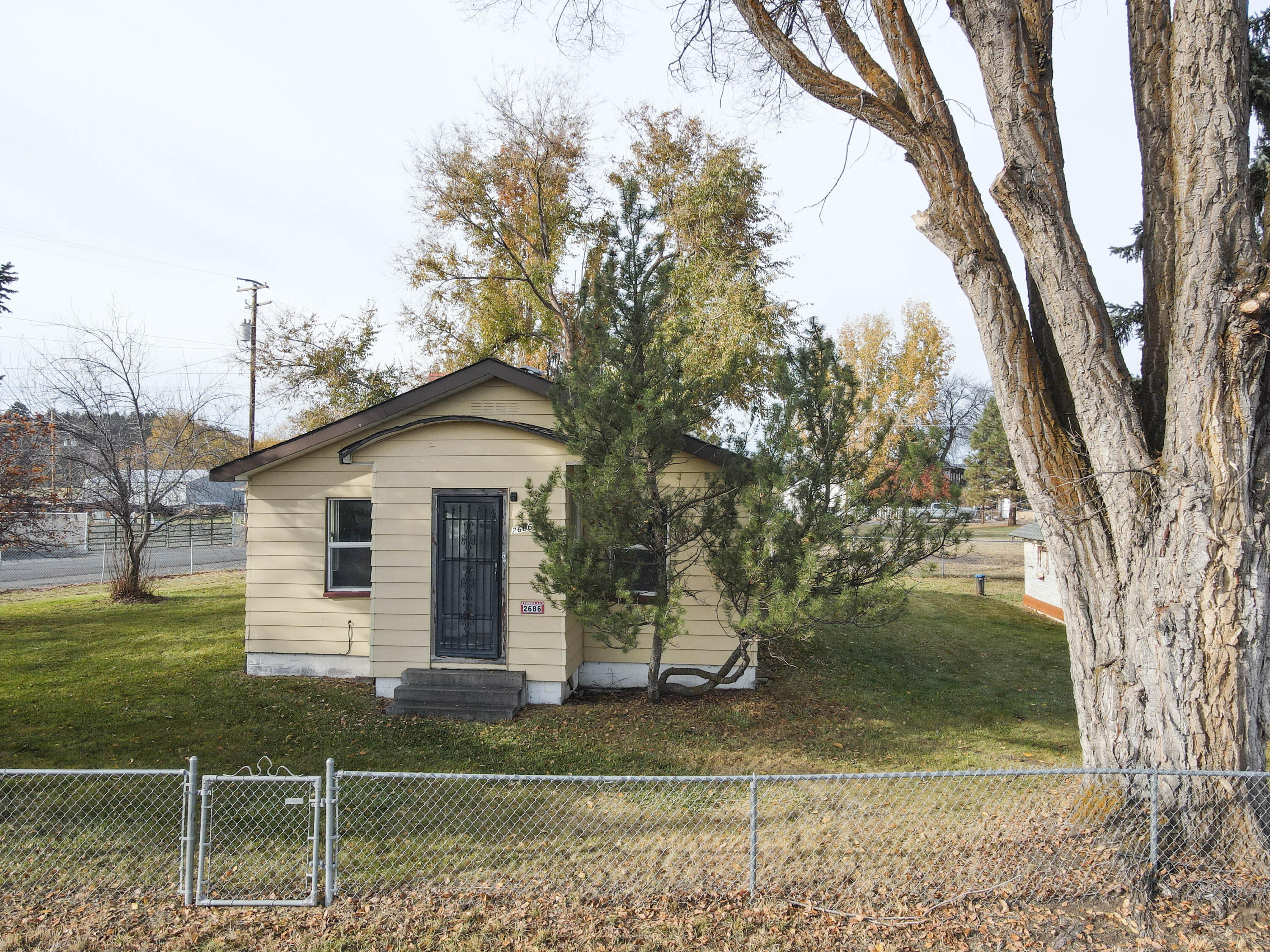 Cozy home on two lots in Bonanza- clean, well-kept 1920 stick-built home totaling .54 acres.  This 2-bed, 1-bath home features natural gas heat, its own well, and city sewer connection.  Plenty of outdoor space for a garden, pets or extra parking.  Great opportunity for a rental investment or a comfortable start up home in the friendly small town of Bonanza.  Please see MLS 220211679 and 220211682.