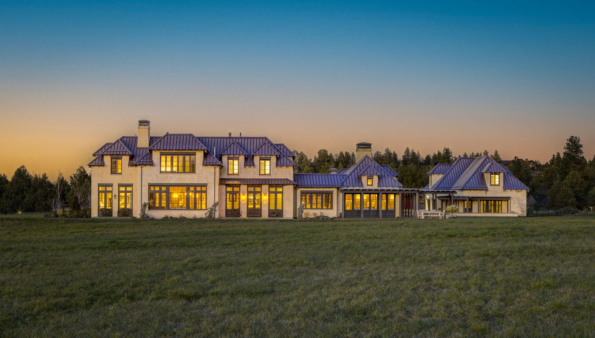 Welcome to the Gist Chateau, where luxury meets tranquility in the picturesque outskirts of Bend, Oregon. Each sunrise and sunset, set to the backdrop of the Cascade Mountains, is a showcased masterpiece at this property. The structures themselves, built in 2010 by RH Construction, are a picture of old-world craftsmanship—ICF construction, custom oak windows and doors, Venetian plaster interiors, and various natural stone finishes, including one grand marble staircase. Spanning 7,744sf and built to highlight the spectacular mountain views, the main home boasts 7 beds and 7.5 baths, while the adjacent 1,275 sf apartment houses 2 beds and 1 bath. With ground water rights to 26 of the 27.4 total acres, it's a paradise for outdoor enthusiasts. Come experience unique, luxury living in Central Oregon at its absolute finest.