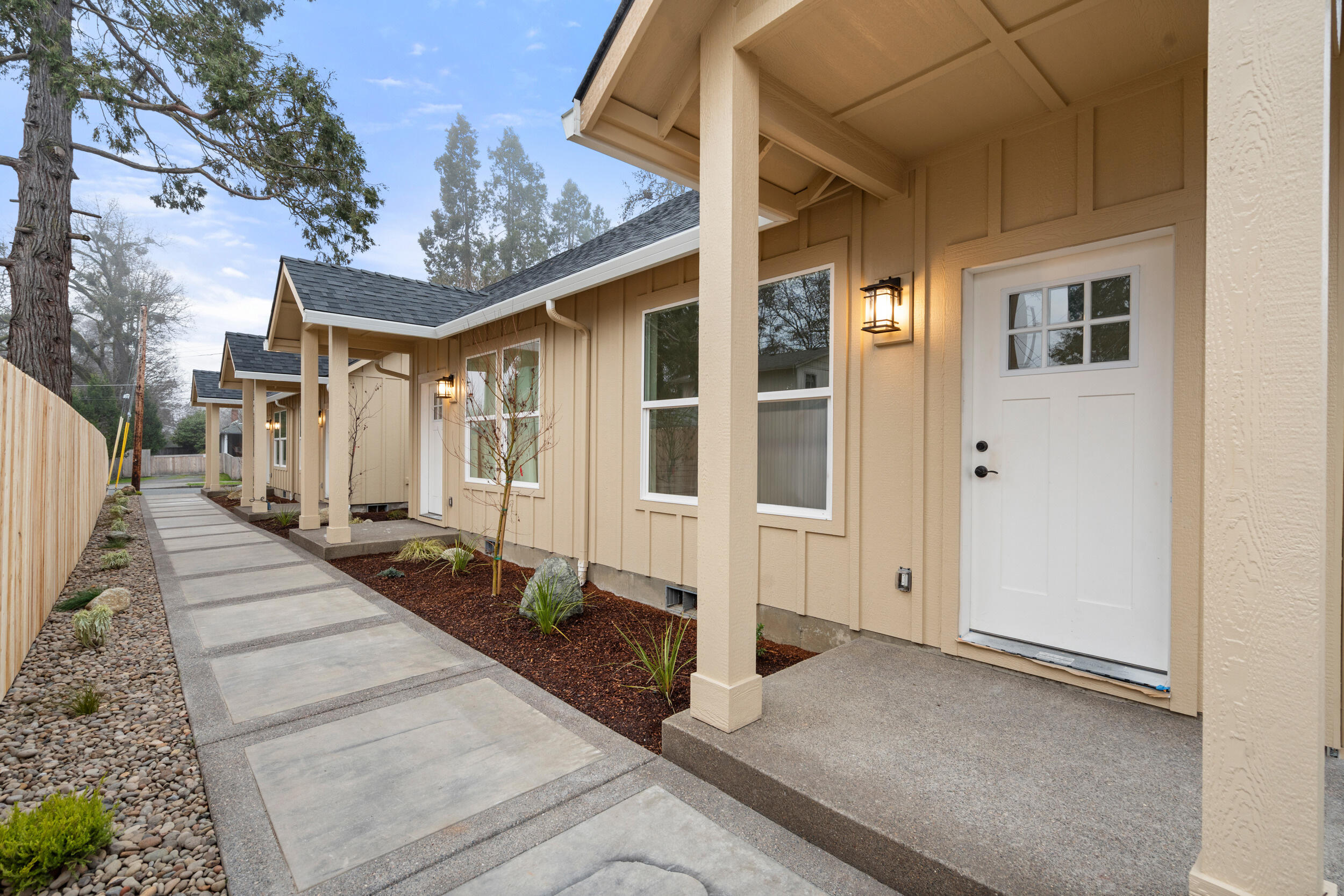 New Construction 4-plex in Grants Pass
This brand-new, meticulously built 4-plex offers a perfect blend of modern amenities and thoughtful design. Each unit features vaulted ceilings with oversized windows, creating an open and airy atmosphere, while granite countertops in the kitchen provide a sleek, contemporary touch.  100% waterproof luxury flooring throughout—perfect for durability and low-maintenance living and providing a true wood like look. Each unit features 1 bedroom and 1 bath, these homes are ideal for those seeking comfort and convenience only a short distance to downtown.
Enjoy the outdoors with a large private back patio. The units are designed with high-quality finishes and energy-efficient features like mini split heating and cooling units, ensuring long-term value and comfort for tenants. Located close to downtown, this property offers easy access to shopping, dining, and outdoor recreation.  Owner is a licensed Real Estate Broker in the State of Oregon.