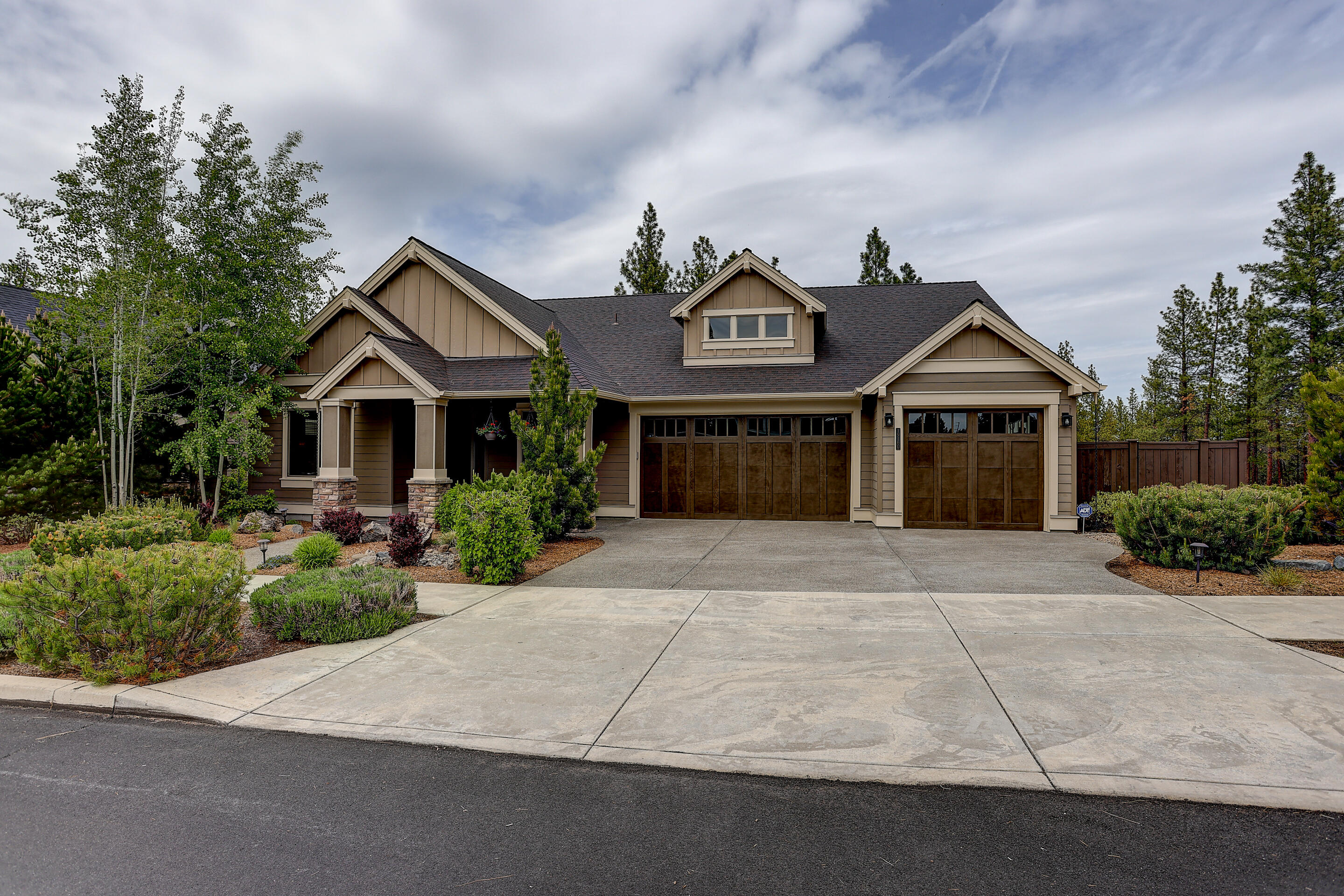 Ideal single-level layout close to Shevlin Park! Pride of ownership abounds in this stunning home. With one of the best corner lots in a coveted westside neighborhood, you will have plenty of privacy as you enjoy the park-like setting from your deck.  Soaring coffered ceilings and an inviting living area with gorgeous chef's kitchen make this home feel larger than 2400sf.  Amenities include both primary and guest suites,  acrylic flooring in the heated 3 car garage, high-end custom built-ins and floating shelves in office, solid doors throughout, and much more. Excellent storage options with a large unfinished space underneath the home.