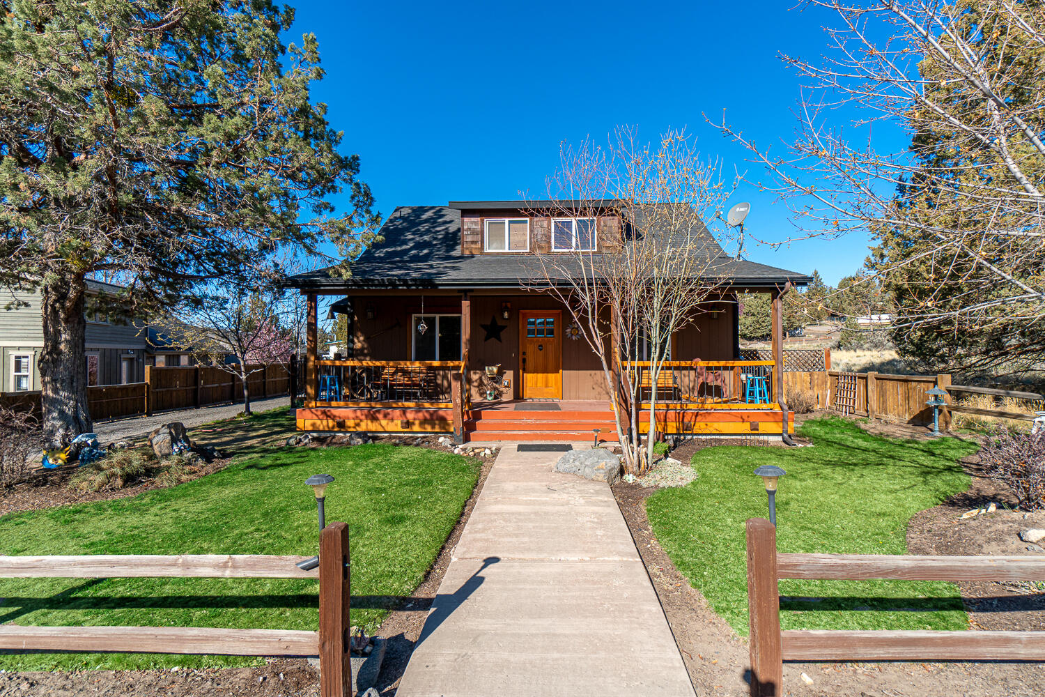 Rustic style home w/ covered front porch & views of the meadow in Ochoco West subdivision. Open floorplan layout w/ spacious living area, hardwood floors, & breakfast bar. Kitchen features tile floors, granite tile counters, & beautiful natural cabinetry w/ formal dining room adjacent to the kitchen. Oversized primary bedroom ftrs carpet w/ a sitting area or office space w/ hardwood flooring. All other bedrooms are large w/ carpet & ftr their own unique built-ins. Large upper bonus room opens up to a balcony area via double doors. Upstairs hallway uniquely ftr built in office space & sky lights for natural lighting throughout. Paver patio along the side of the home has the perfect barbeque area. Gravel drive w/ plenty of space for your RV or Boat. Extra storage plus a large gated & fenced ]backyard. Just NW of Prineville. Enjoy all the inviting amenities Ochoco West has to offer; including a clubhouse, swimming pool, horse stables, rifle ranges, and fishing. Water on Huston.