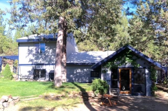 Located on the outskirts of Bonanza is this charming home waiting to welcome you away from the hustle and bustle of the busy world and into the peace and quiet country life. It is accessible year round on a dead end road that backs up to BLM. The upstairs loft/bedroom area could easily be changed to a great master suite by adding a bathroom. The extra room downstairs could be converted to a third bedroom by adding a closet. Plumbing and electrical wiring have been updated to code. The horse barn has four stalls and cement floor. The great little shop comes with tools and equipment. The garden area is nicely fenced to keep the critter out. There is also a pump house, dog kennel, extra carport/hay storage building, a large water storage tank in the pump house for fire protection, and so much more.