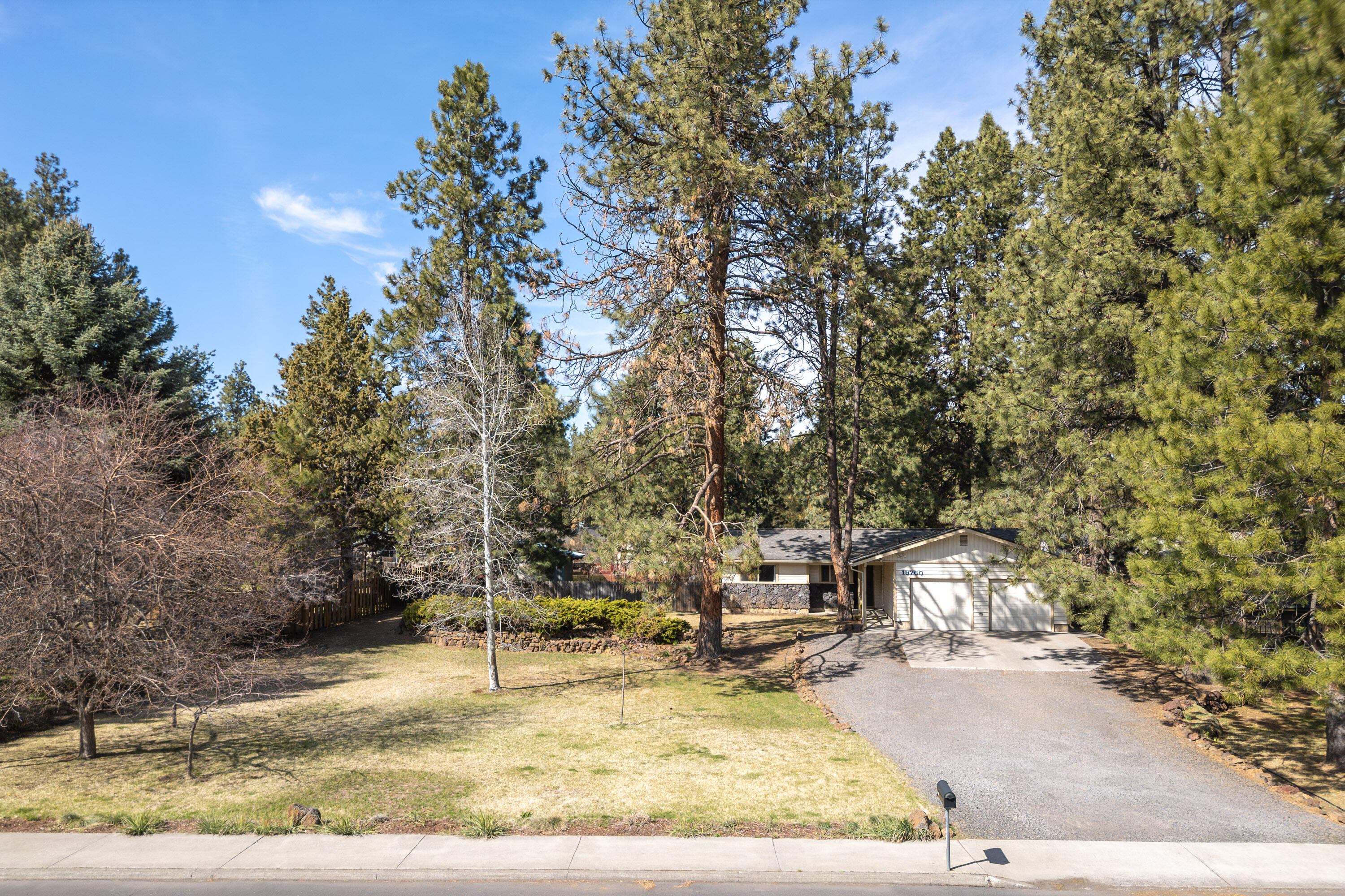 Welcome to this beautiful single-story ranch home, offering 3 bedrooms and 2 full bathrooms, perfectly situated on a spacious .44-acre lot. This charming property boasts a welcoming entryway and a fantastic floor plan that seamlessly flows from the kitchen to the dining and living areas. The kitchen features stainless steel appliances and sink, a pantry, and a convenient breakfast bar. The cozy living room is enhanced by a charming pellet stove, and french doors open to the back patio, offering the ideal space for indoor-outdoor living. Throughout the home, you'll find lovely wood floors and tile, as well as ductless mini splits for year-round comfort. The private fully fenced backyard is an entertainer's paradise with a large patio, raised garden beds, and plenty of space for relaxation or play. The property also includes a detached shed/garage with lean-to covered parking for added convenience. This well-maintained gem is ready to welcome its next owners. Close to Brookswood Plaza!