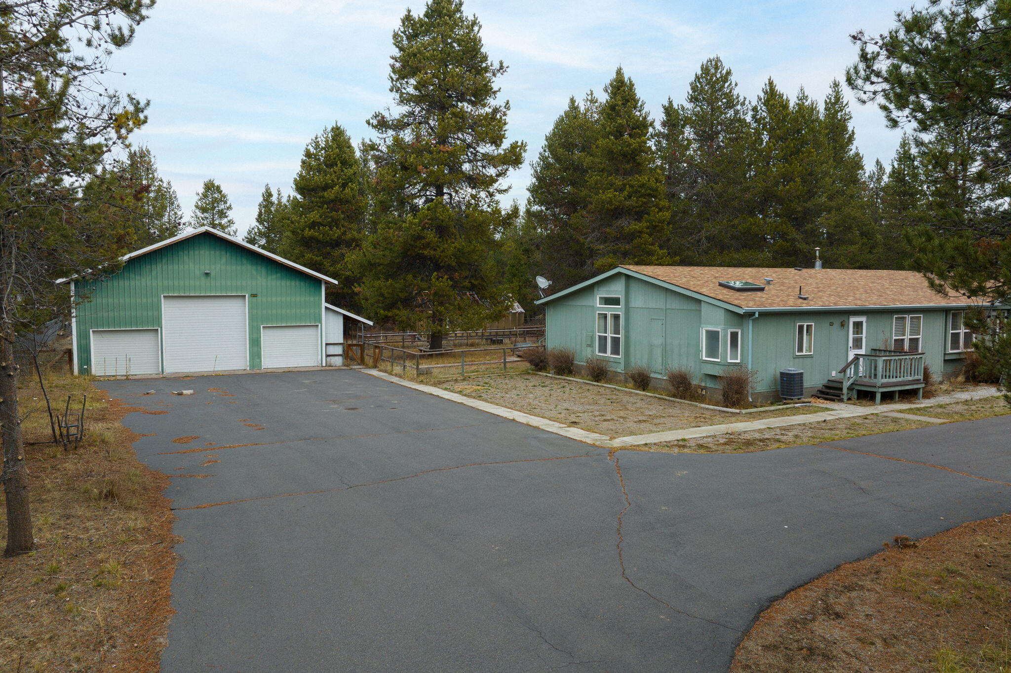 Move-in ready 3-bedroom, 2-bath manufactured home on 1.01 private acres surrounded by forest. Feels like custom build w/ super insulation & 2x6 walls. Living room w/ vaulted, beamed ceilings, certified wood stove & windows for natural light.  Kitchen w/ tons of prep space, cook island, walk-in pantry & wall of windows. Family room w/ certified pellet stove, skylights & sliders to  back deck. Primary suite w/ vaulted beamed ceilings, 2 walk-in closets, spa-like bath w/ skylights, dual vanities, walk-in shower, walk-in tub, flex space w/ built-ins ins for office or reading nook w/ sliders to deck. 2 more bedrooms, guest bath, & laundry room w/ built-ins, utility sink & exterior access for mudroom after yardwork. New carpet, laminate & roof in last year. 35x22 3-bay detached RV/garage w/ attached 23x35 shop w/ guest apartment w/ kitchen for multi-gen living. Upper shop level (22x11) includes bathroom. Room for animals, gardening, & outdoor living. 5 minutes to LaPine State Park.