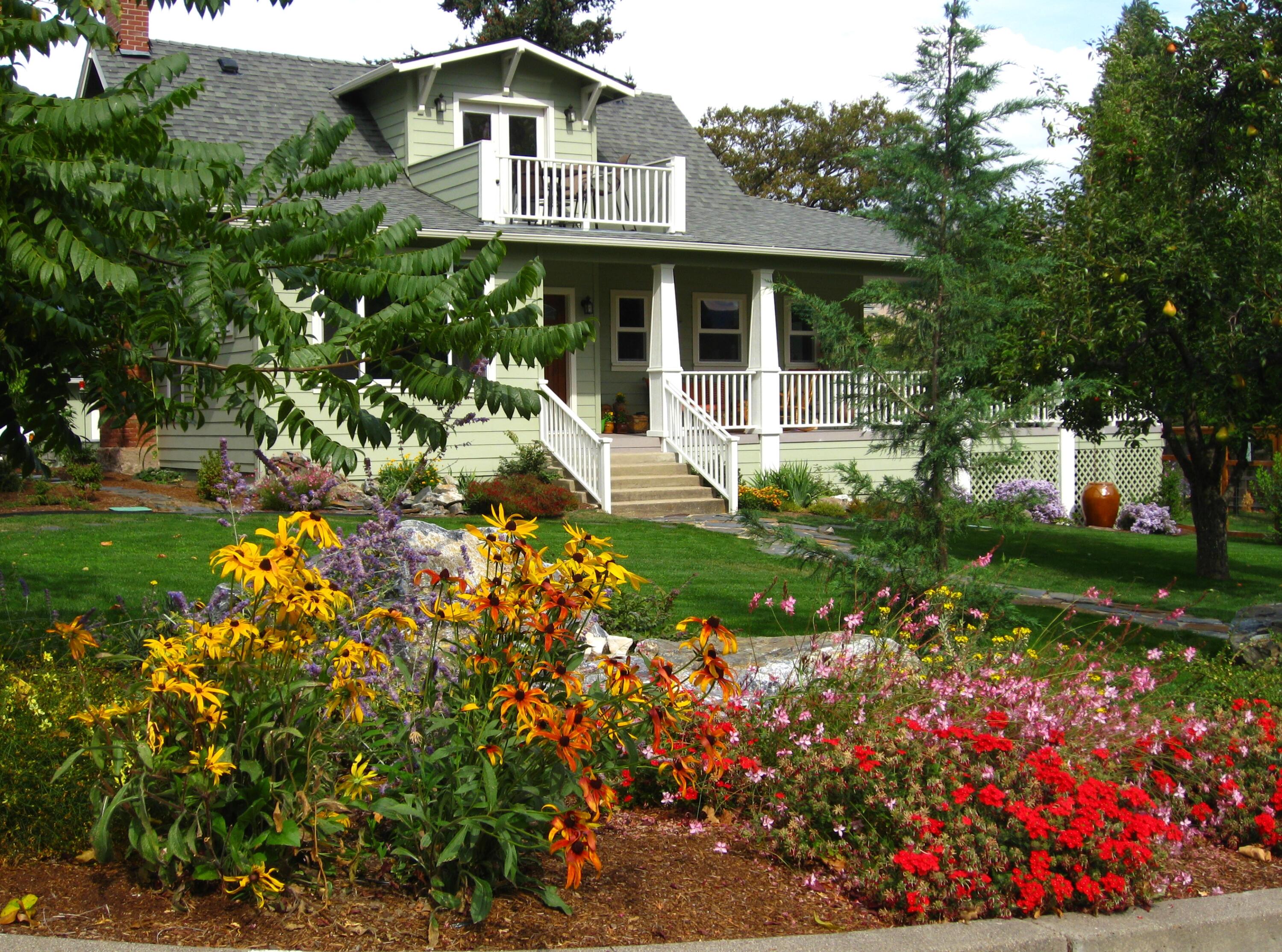 Winner of the 2012 Historic Preservation Award, this beautifully renovated 2,300 sq ft. home comes with a 720 sq ft guesthouse for a total square footage of 3,020. This home is situated in a well-established Ashland neighborhood, conveniently walkable to downtown. Modern open floor plan. Main-level living boasts a gourmet kitchen, primary suite with tiled bath, 2 additional bedrooms, second full bath, plus a half-bath for guests. Expansive decks offer mountain views. Beautifully landscaped grounds with perennial gardens, fruit trees & flowering shrubs are served by a zoned irrigation system. Hardwood floors, walnut cabinetry + built-ins add warmth throughout the well-appointed living space. Upstairs is perfect for office or 4th bedroom with half-bath and private balcony. New HVAC, electrical, and plumbing systems installed during 2011 renovation. Detached guesthouse, built in 2016, is currently a 5-star VRBO rental, or use for guests, Mother-In-Law or office/studio.