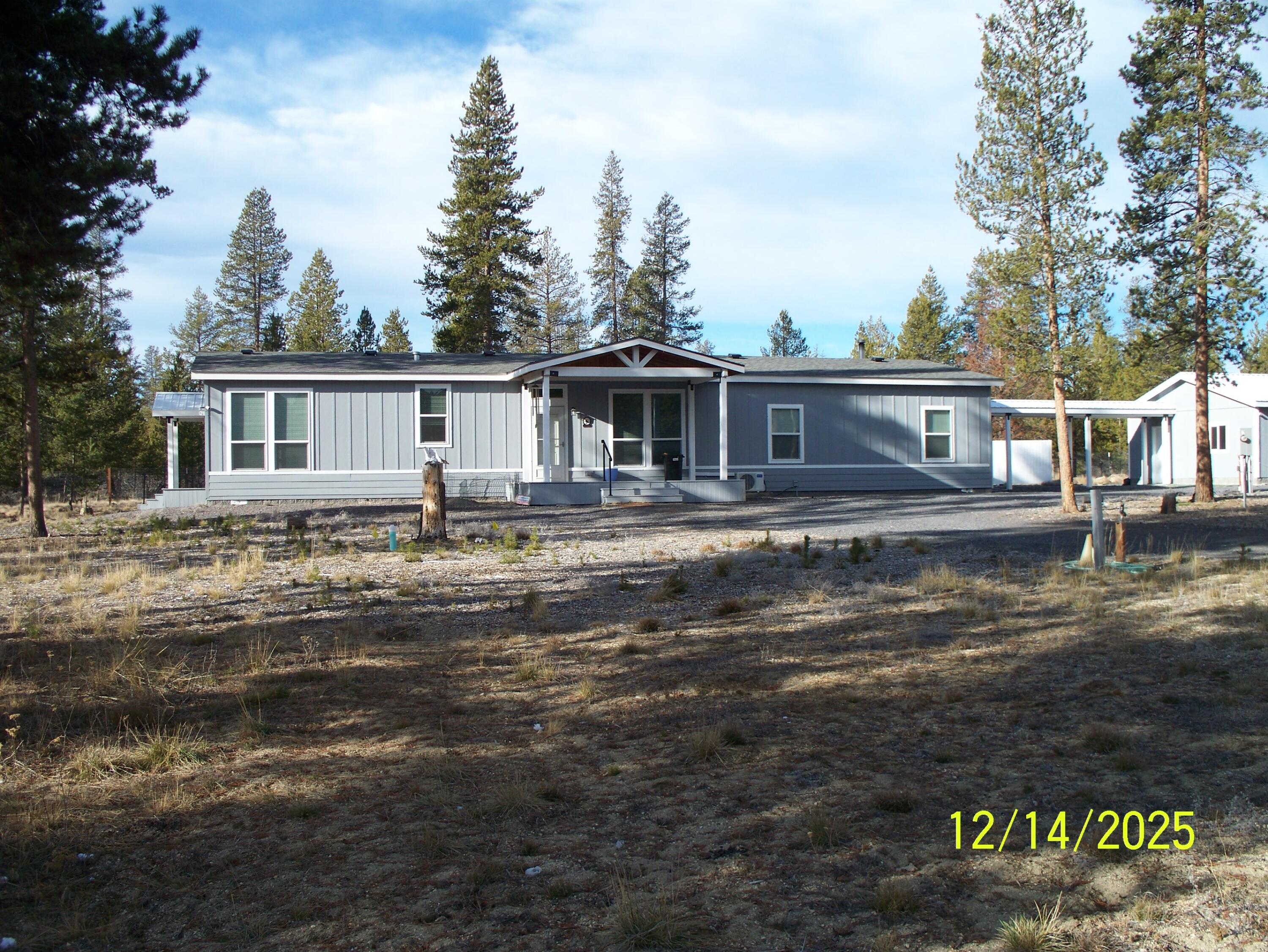 Looking for a Home that backs up to BLM land!! Discover modern country living in this 2020 home on spacious 2-acre estate!  Featuring great primary separation and large walk-in closets in all bedrooms, it's designed for comfort and functionality. The huge kitchen boasts numerous cabinets, a massive island, and large butler pantry with numerous cabinets - perfect for culinary enthusiasts. Large laundry room with extra cabinets add convenience. Outside you will find A 2-car garage, partially insulated with a covered walkway from the house, ensures privacy with full fencing. Additional highlights include three sheds, a small green house, and a fantastic outdoor setting.