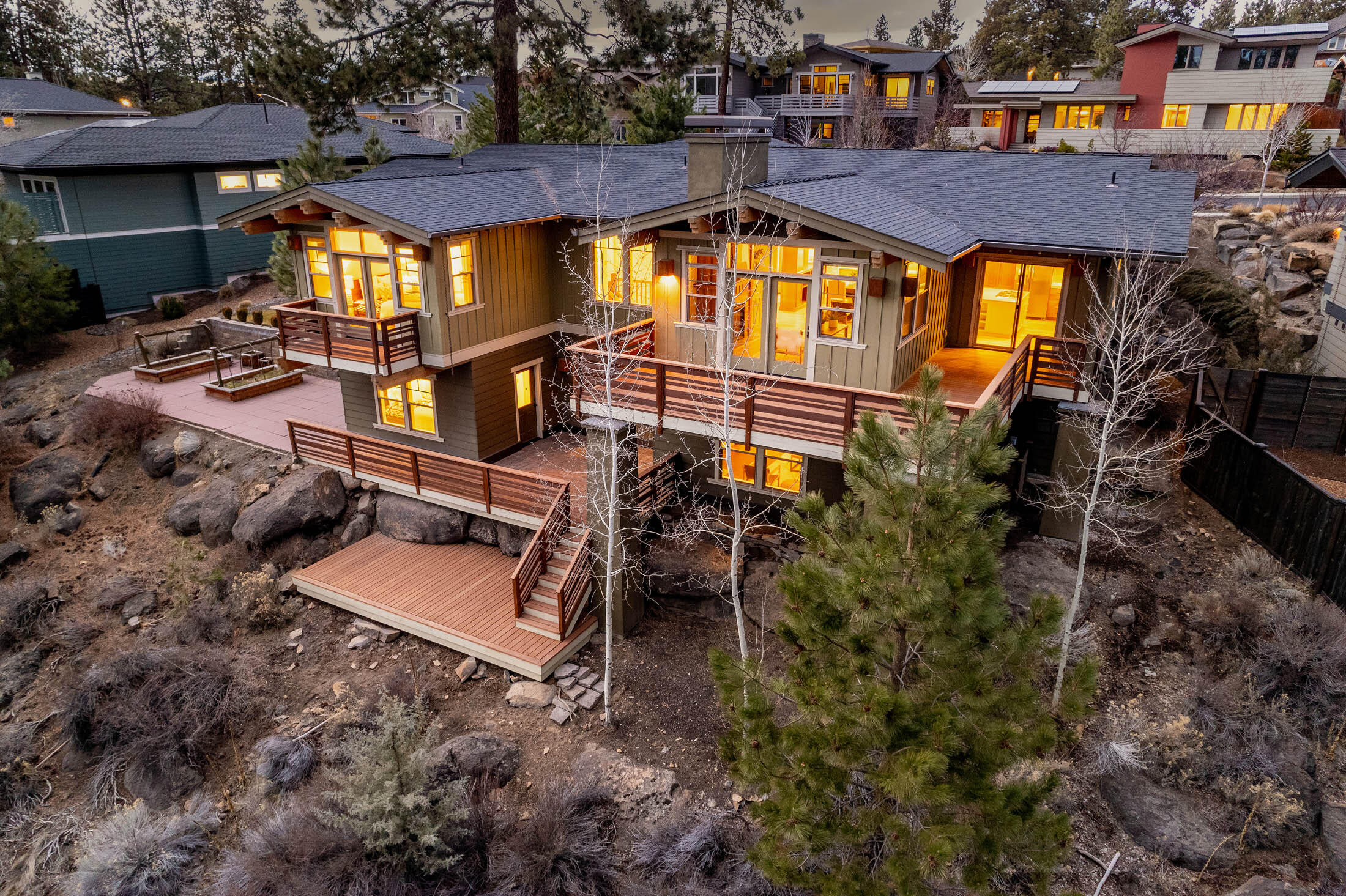 Set on a picturesque street of estate homes on a third of an acre lot in Northwest Crossing, this timeless craftsman delivers it all. Here, natural wood, abundant windows, and sunny southern exposure create an open and inviting space. With high ceilings, an open layout between the kitchen, dining and living rooms, and handcrafted custom cabinetry, this house perfectly combines, charm, warmth and livability. The main floor master suite includes a luxurious bath and walk-in-closet, with an additional two bedrooms providing a most functional main level layout. Downstairs, you will find a private flex space with a full bedroom, bath, and a versatile exterior entrance. Multiple expansive decks offer space for gathering and relaxing, while raised garden beds and natural landscaping complete this Central Oregon gem!