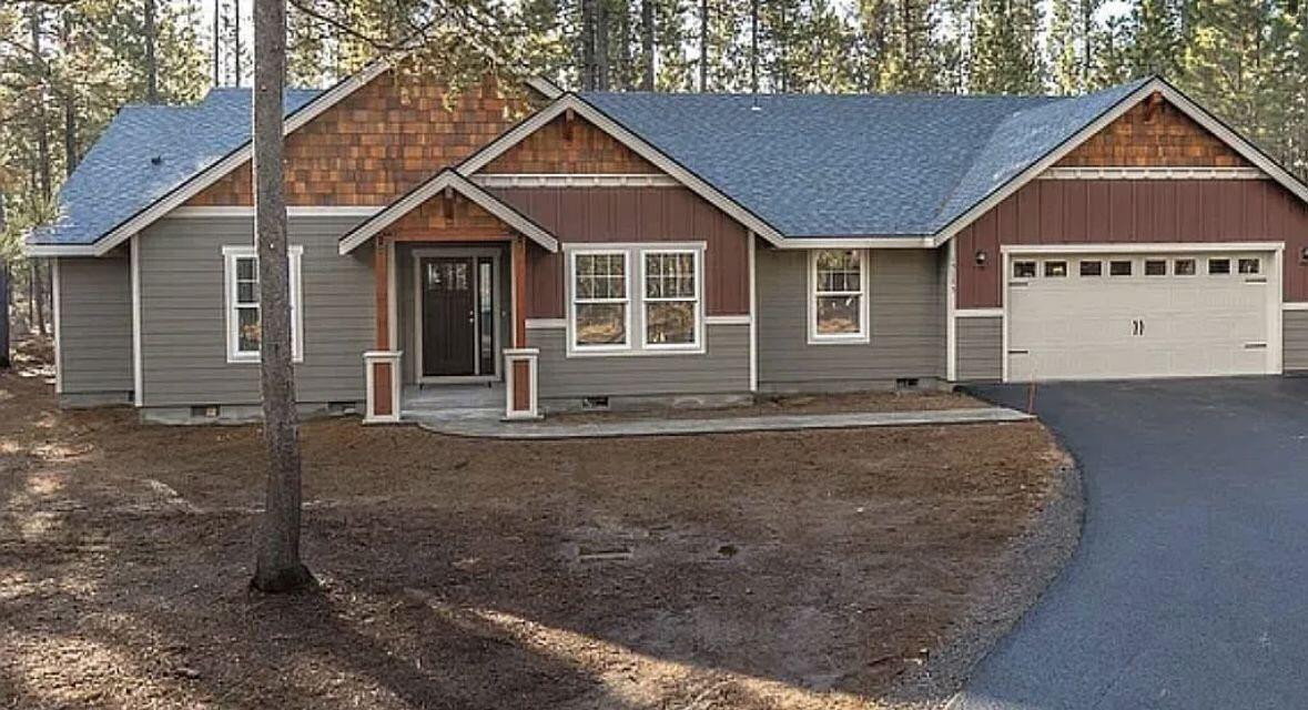 Located in the fabulous Ponderosa Pines neighborhood, this home backs up to over 12,000 acres of forest with great walking and biking trails; and just minutes from the Upper Deschutes River. This is a single level spacious home with 4 bedrooms 2 baths, vaulted ceiling, and an open great room floor plan. The kitchen consists of engineered bamboo hardwood floors, farmhouse sink, granite counters and opens to a 14' x14' covered back patio. Featuring an oversized 2 car garage with shop area which includes a dedicated 220 volt welding outlet - great for a home gym; home office or shop. RV parking pad. Additional 200 amp service for future use. A 20' X 20' shed big enough for all your tools and extra storage with an attached cover. This home features a hot tub paver pad - ready for your hot tub and a large custom play structure perfect for the kids or grandkids. Spacious 1.28 acre lot provides added privacy and plenty of room for an additional shop. HOA fee includes your water usage.