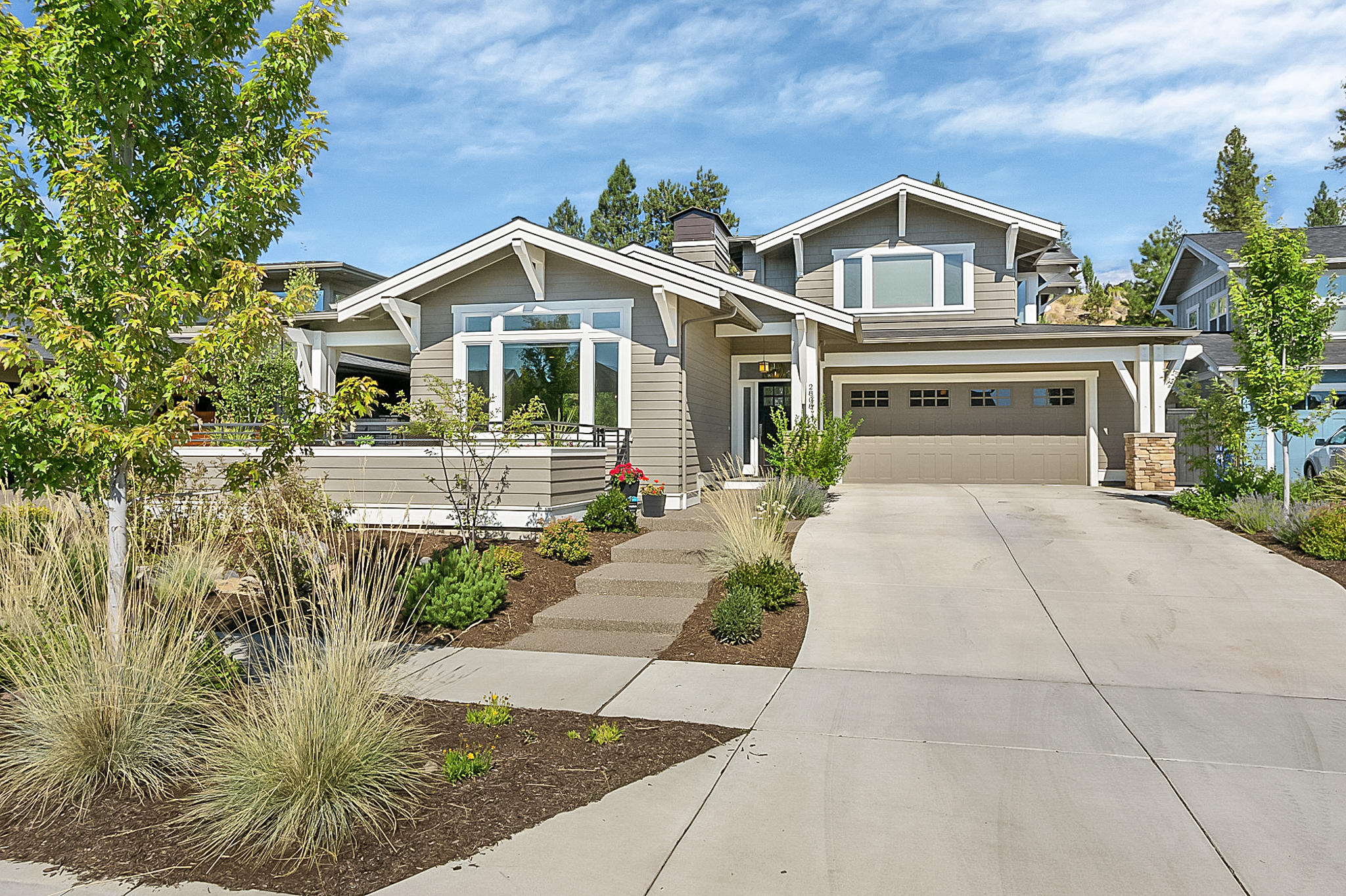 This impressive Northwest Craftsman style home combines high-end finishes with timeless beauty. Tall ceilings, abundant light and expansive living spaces make this a truly unique home in one of Bend's most sought-after communities. Beautiful hardwood floors run throughout the main floor, cozy fireplace winged by built in book shelves in living room, stunning kitchen with Thermador appliances, stainless steel farm sink and slab granite counters. Private master suit on the main level plus den/office with french doors. Upstairs you will find a rec room, built-in desk area, guest bathroom and 2 additional bedrooms. Over-sized garage w/ bonus shop space, and a large fully landscaped and fenced backyard. Home has a 6KW solar power system that makes the power bills next to nothing. The thoughtful design of the home, along with its multiple outdoor spaces makes it very easy living.