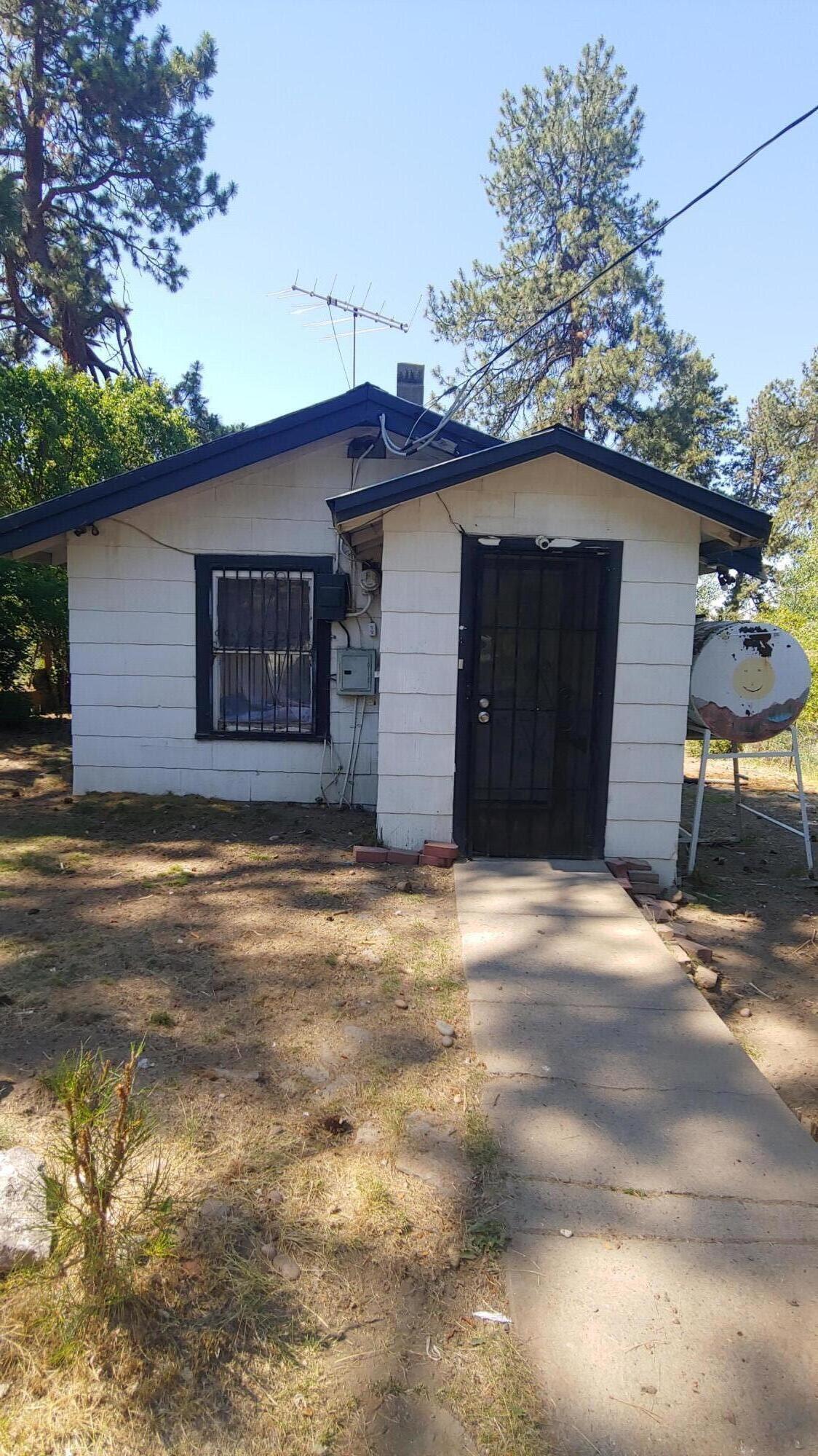 Very clean neighborhood, 1 bed 1 bath home in Chiloquin City limits. vinyl/hardwood flooring, shower/tub combo, with bathroom in mid remodel. Vinyl framed windows, Deck, and Out Building for storage. Ready chicken coop, Alley access and Paved road. This home is sold AS IS and ready for your ideal finished carpentry by the Holidays!