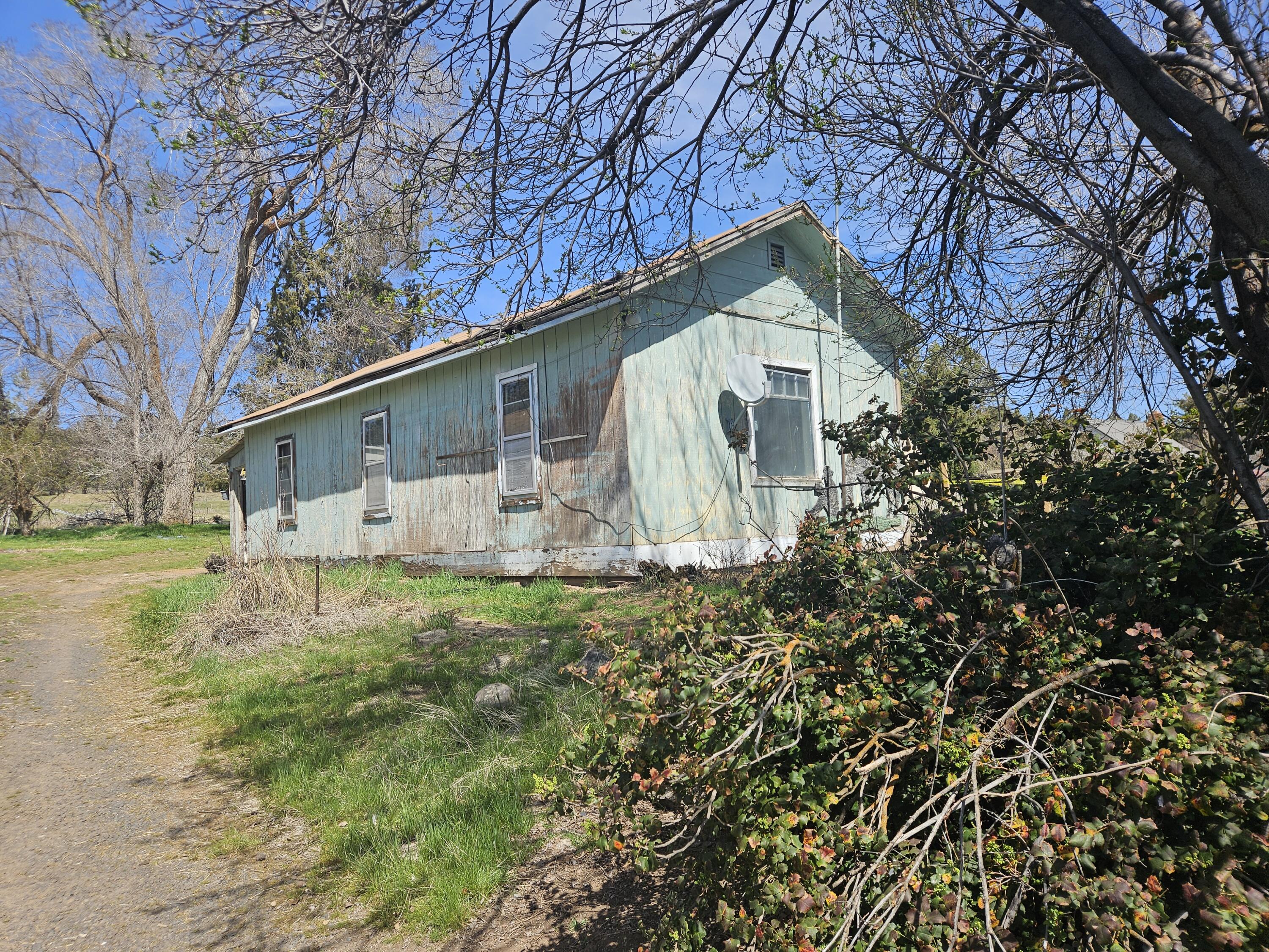 This property is just outside of town! It has 1.97 acres and a 2 bedroom 1 bath home. Large shed and an enclosed back porch.