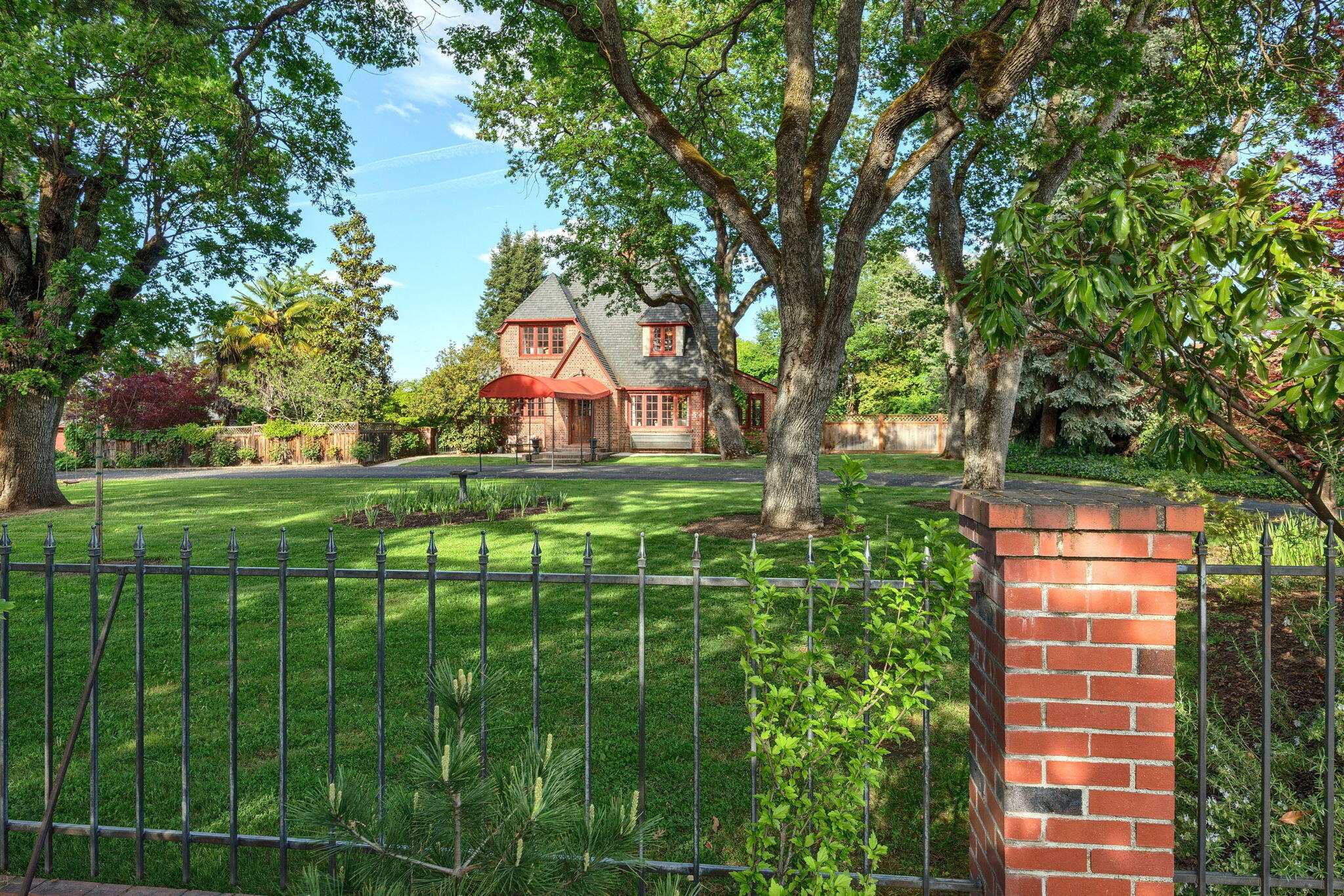 Step into timeless elegance with this stunning Frank Clark- designed French Provincial estate, set on expansive, park-like grounds adorned with mature oaks, conifers, and redwoods. Zoned for commercial use, the property presents a rare opportunity for transformation into a high-end restaurant, boutique office park, or luxury retreat-with ample space for parking and potential expansion. Originally built in 1925 and listed on the National Register of Historic Places, this architectural gem offers 3,648 sq ft across three stories in the main residence, featuring three bedrooms, two full and one half baths, three elegant fireplaces and exquisite period details. An attached 644 sq ft office or guesthouse- with its own fireplace and full bathroom - adds charm and flexibility. Meticulously preserved, this estate can remain a private residence or be reimagined for commercial use. A truly unique opportunity to own a piece of history with endless potential.