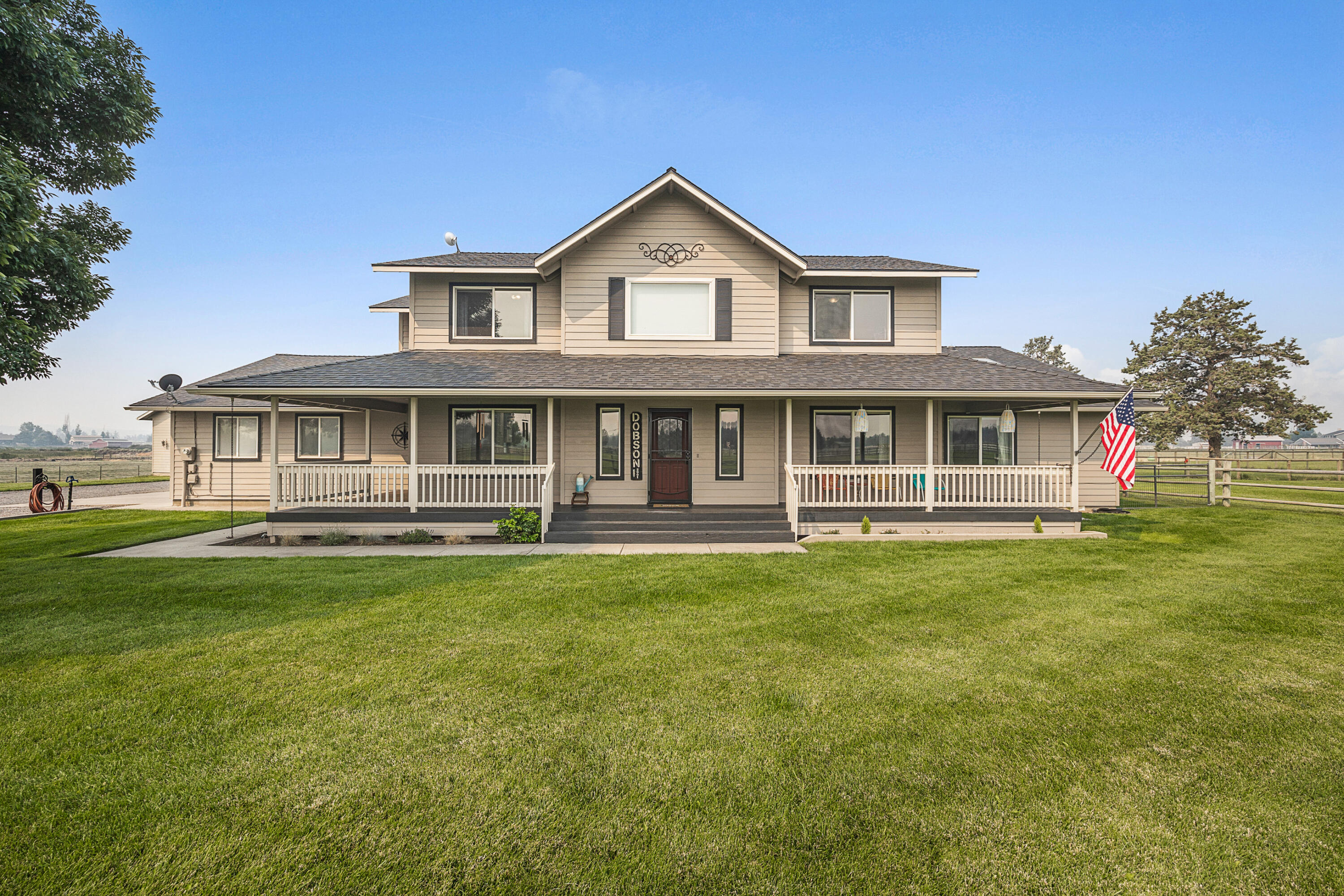Your forever home in the desirable Equestrian Meadows in N Redmond is ready for your next move! With Cascade mountains and Smith Rock views, this perfect place is complete with a substantial, gorgeous dream farmhouse, six acres of property with 3.9 mapped irrig. water rights, pond, large shop, RV hookup, and plenty of space for your outdoor equipment. Covered front and back porches create cozy spots to soak in the panoramic views, while a fun, covered patio area will welcome your guests for fabulous dinner parties. The open floor plan, vaulted ceilings, french doors, expansive kitchen island, bright den space, and two primary suites offer plenty of space for all of your entertainment needs. Don't miss the rare opportunity to own in this special Redmond neighborhood!