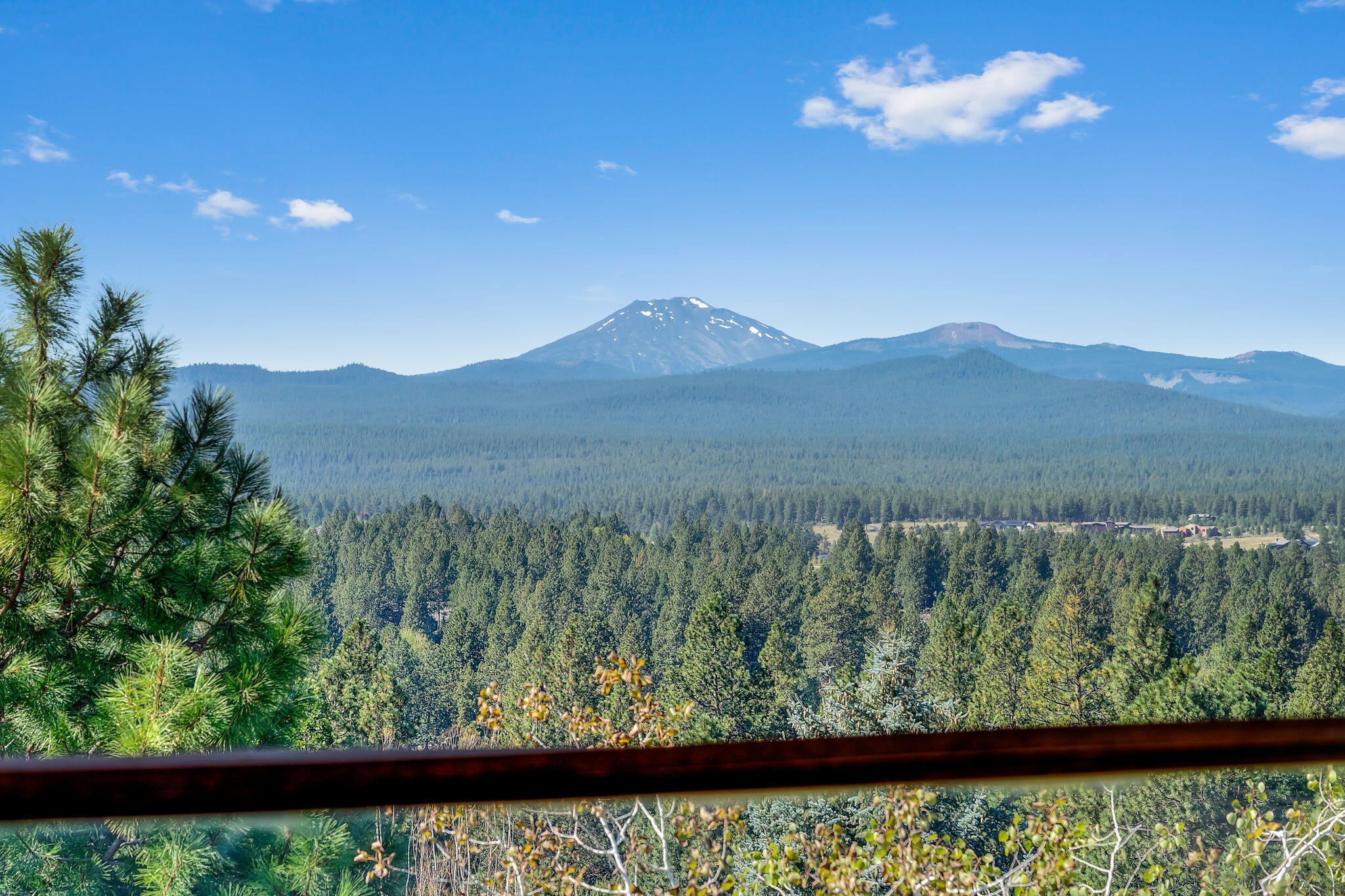 Outstanding Westside location! Impressive contemporary situated on a quiet cul-de-sac atop SW Bend's Golden Butte w/show stopping views of snow-capped Cascade Mountains and southern terrain from the covered view deck, as well as eastern and northern buttes. True Greatroom plan w/open kitchen & raised eating bar, large dining & living areas surrounded by captivating view windows that punctuate the Westside view experience. The Primary Suite off the Greatroom offers deck access to a flat fenced back yard. Entry area office across from the cozy gathering room w/fireplace & wet bar. A large media room is perfect for watching movies. Two additional bedrooms & full bath also on the entry level. Central vac, indoor/outdoor speakers & energy efficient solar panels. Triple car garage. Huge finished storage off the media room. Backs to Overturf Butte open space & trails, all just minutes from Bend's top-rated schools, dynamic downtown with its celebrated shops & eateries and Northwest Crossing.