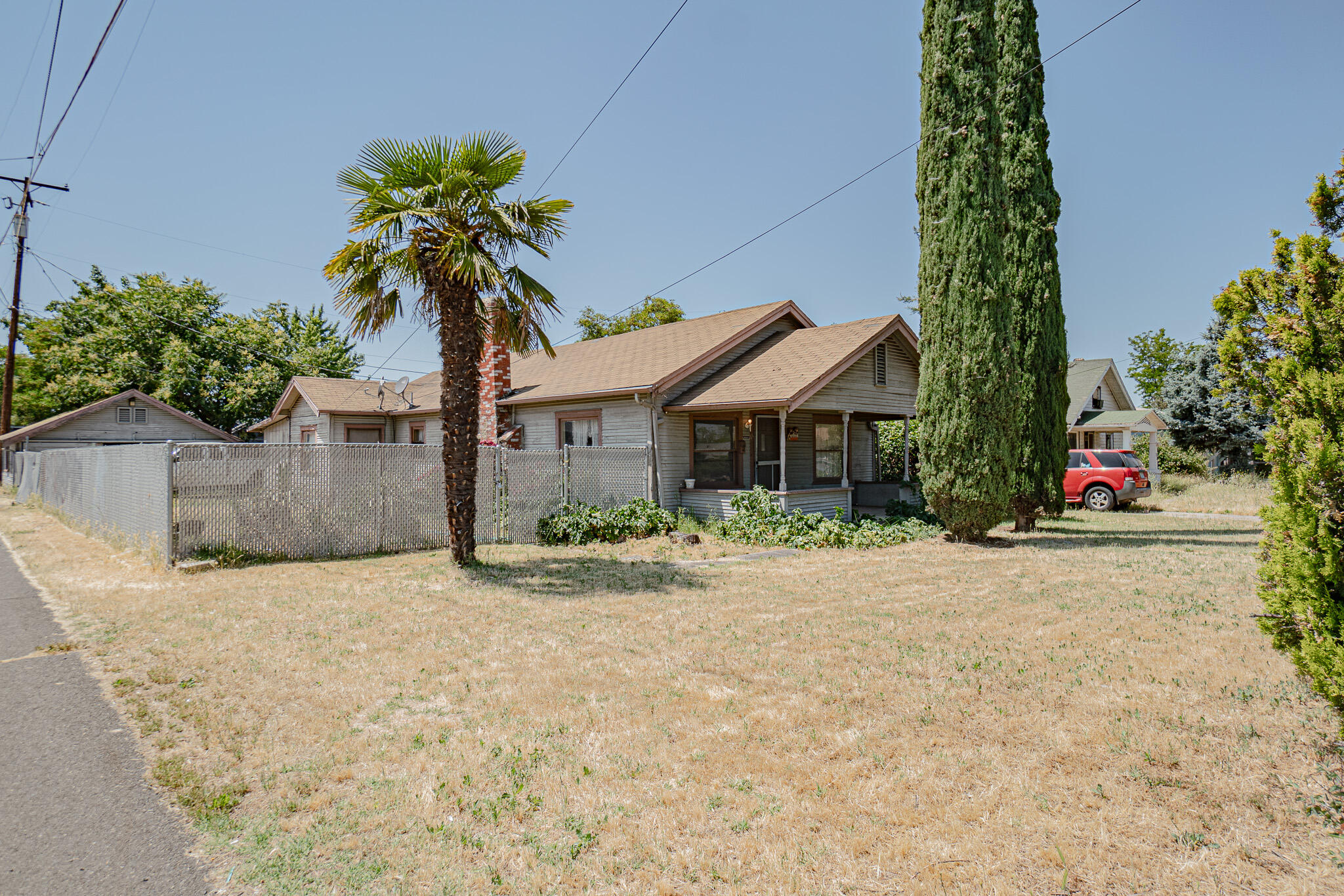 Unlock the potential of this classic Medford home, ready for those with creativity and vision. Located on a quiet street near the heart of town, this property offers solid bones, a spacious lot, and timeless charm that's waiting to be revived. It's ready for a full transformation, offering the rare chance to shape each space exactly the way you envision. Create an open-concept layout, restore original features, or design something entirely new—this is your chance to shape a space that reflects your unique style. Surrounded by established homes and close to shopping, dining, and parks, the location is as promising as the project itself. Whether you're dreaming of a modern refresh or a nostalgic restoration, this property is your blank canvas. Rarely do homes with this much potential and promise come available—bring your ideas, your passion, and make this your next masterpiece.