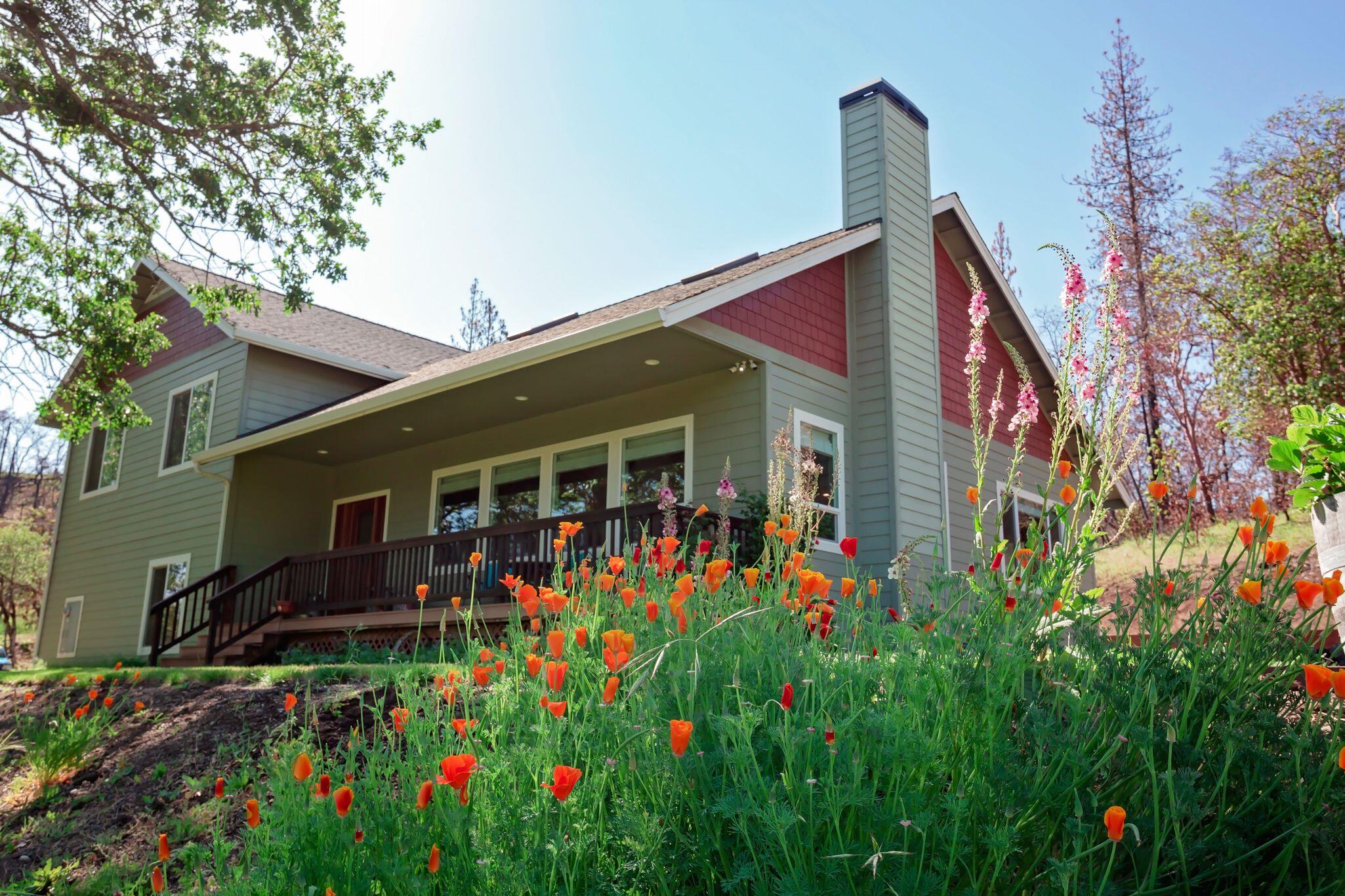 Country living at its finest, only 10 minutes from Eagle Point! Beautifully built home in 2009 with so many great features. As you enter the home the great room features 2 skylights and a wood burning fireplace. A formal dining room offers French doors for entertaining outside. The kitchen features granite counter tops with knotty alder cabinets and plenty of seating around the island. There are hardwood floors and carpet throughout the home. You will find the laundry room on the 2nd level as well as his and hers closets in the master bedroom. The master bathroom has a jetted soaking tub with separate tiled shower. The home offers an oversized 2 car garage with storage bay. There is a small pond on the gently sloped property, additional garage with tack room, small pig barn with 2 horse stalls. All that's missing are the horses!