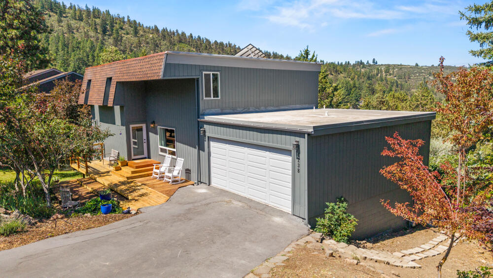 Check out the rest, then come see this remodel on the sunny side of Lynnewood, high above it all. Three lake facing decks with three different views from a private space in the yard to an expansive view above it all off the primary bedroom. Vacant and ready to move in. Three bedrooms and 3.5 bathrooms all upgraded. The kitchen features a central island framed out by an expansive window view over the trees to the lake. How about an average electric bill of $30 a month ($1 a day for electricity); take that Warren Buffet. And you won't even see the solar panels that adorn this Duro last roof. Guests and friends will love the open contemporary vibe created throughout. Moore Park entrance less than 50 yds from the front door. Grab some plums, apples or apricots and step into our bonus studio and half bath with a separate entrance. Only reason you would ever sell this house, is because you have to leave K-Falls behind.   Vacant and ready to move in.