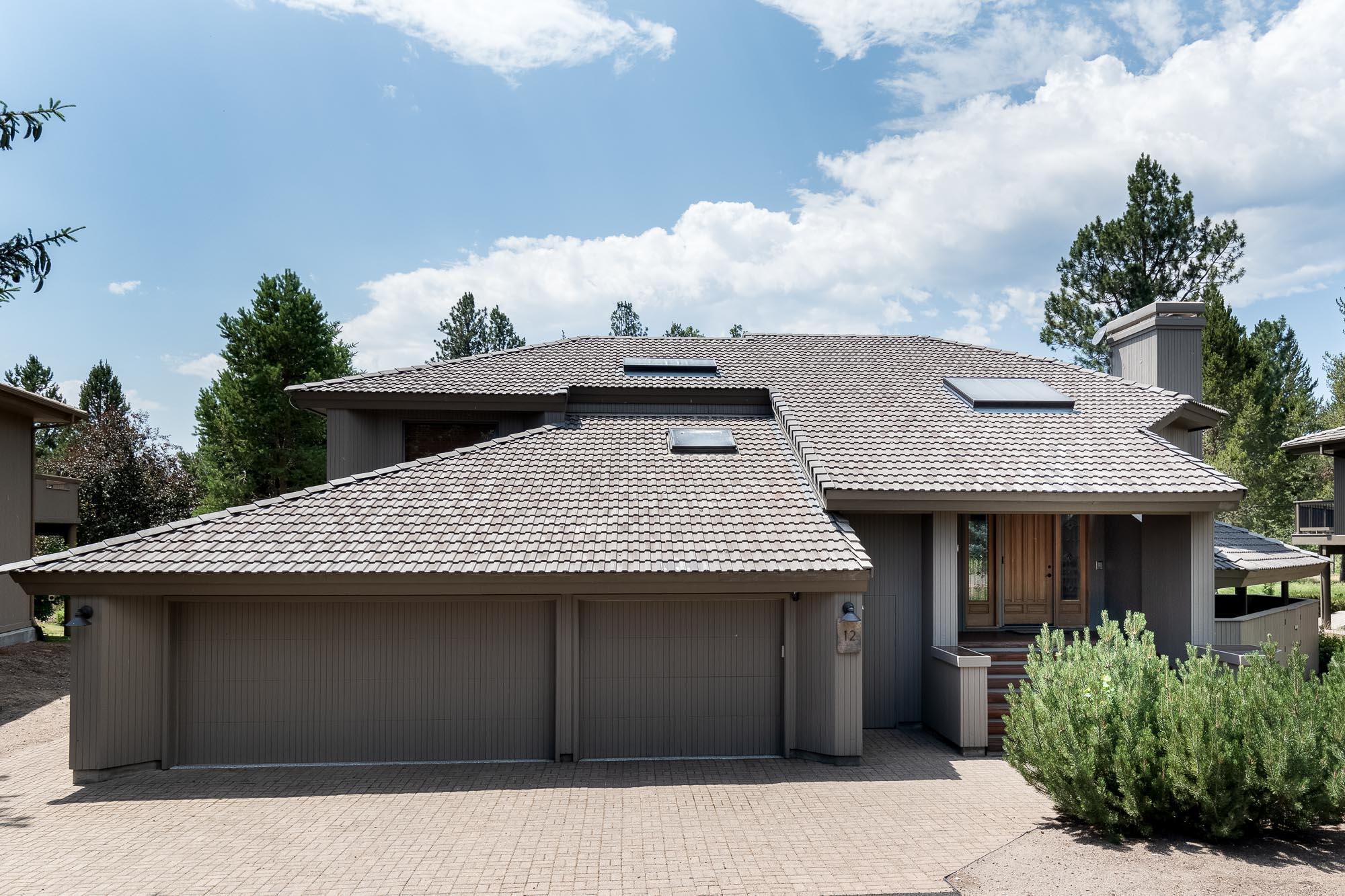 Imagine endless views from your Sunriver Resort retreat on sought-after Mulligan Lane! This great north end setting boasts excellent views of Woodlands Golf Course, the GC pond nearby & Mt Bachelor from the amazing wrap around Trex deck. A truly smart home controllable from anywhere! Sun Forest Construction w/ many recent upgrades. Vaulted great room w/ wood burning FP w/ Gas start . Kitchen offers slab granite counter tops, gas cooktop, double ovens, wine cooler, Subzero fridge & great pantry. A theater/media room w/ audio/visual & stadium seating provides a get-away. Don't miss the adjacent bonus area & full bath completing the upper level. Downstairs, the spacious primary bedroom suite offers a walk-in closet & access to the lower deck area & new BullFrog hot tub. The primary suite bath features a claw foot tub, pedestal sinks & spa-like steam shower.Second & 3rd guest suites offer resort style living. Finished, 3 car garage + shop area & golf cart access door.  SHARC Paid
