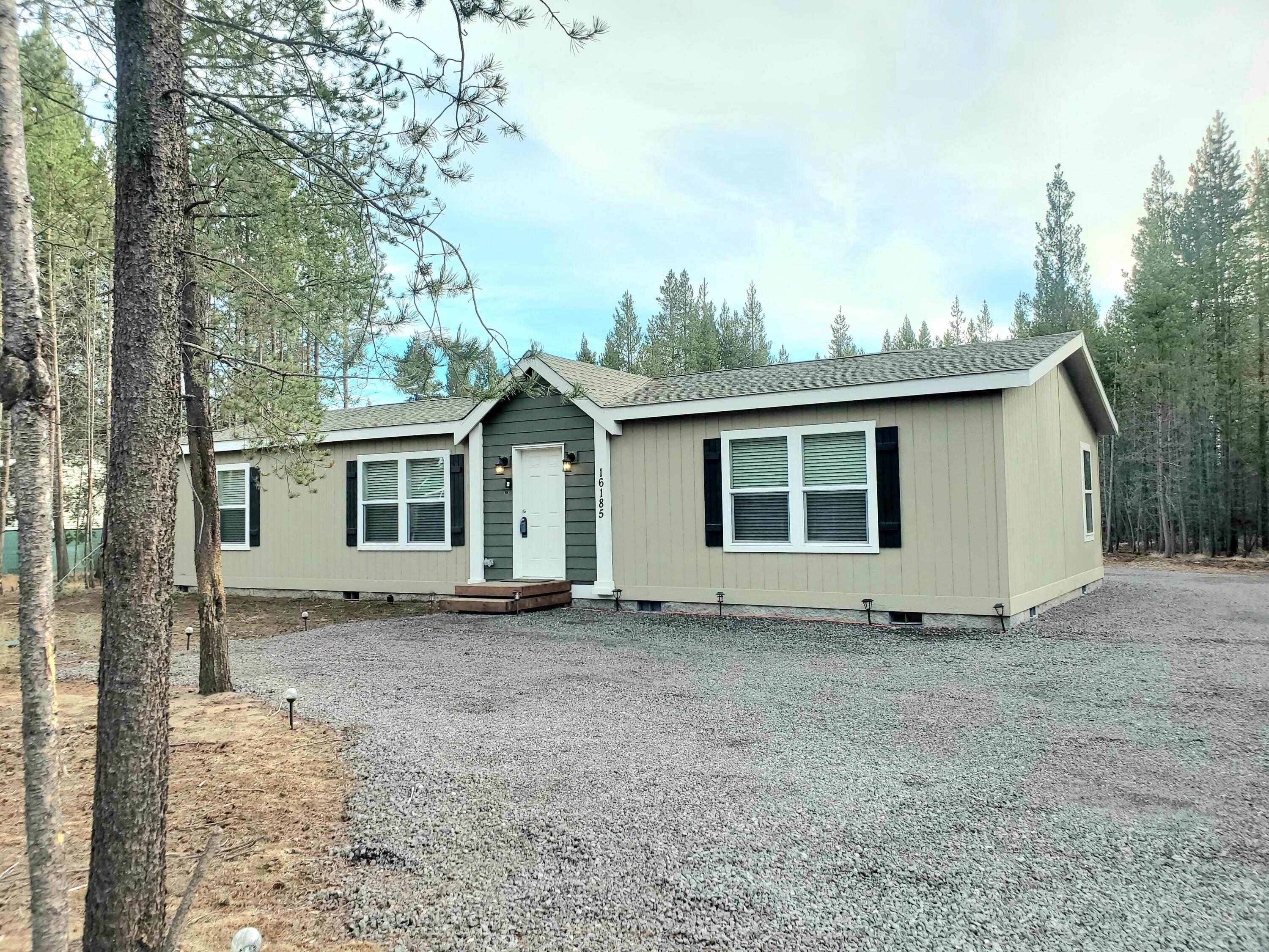 New Price PLUS seller to contribute $10,000 towards buyers closing costs, pre paid items and or rate buy down!
On a paved Road! 
Newer 2024 Home, ATT Septic System and Well!  Set back from the road, fully fenced and nestled in the trees with room to build a shop/garage.  This gorgeous home features an open floor plan with huge kitchen island and tall ceilings.  Primary ensuite is spacious and bath has double vanity sinks plus additional vanity area.  All bedrooms have walk-in closets too.
There are extensive gravel parking areas for vehicles and RVs plus a
new 20x30 Metal Carport to park out of the weather!