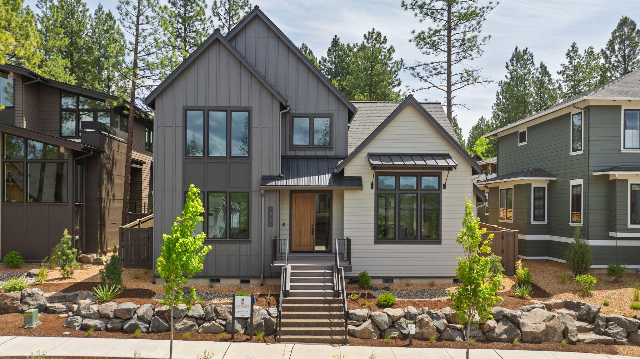 Welcome to Structure Development's 2025 COBA Tour Home in the highly desirable Talline neighborhood. This stunning European farmhouse-inspired build is the perfect Bend home, balancing comfortable, spacious living with a low maintenance ''lock and leave'' lifestyle.  Each morning, a quick peak at the Cascades from your great room will lead to the perennial spring dilemma; throw the skis in the sprinter for some slushy turns or hang the mountain bike on the rig for some muddy fun. Each evening, your inner chef will be inspired by this gourmet kitchen, adorned with veining quartz counters, an oversize island and top of the line JennAir appliances. And every day, you'll make memories as you gather inside near the warmth of the gas fireplace, or outside, under the covered patio for open air meals. From 11' ceilings to carefully curated tile selections and thoughtful design that adds elegance at every turn, this one-of-a-kind home in the heart of NW Bend, is sure to exceed your expectations.