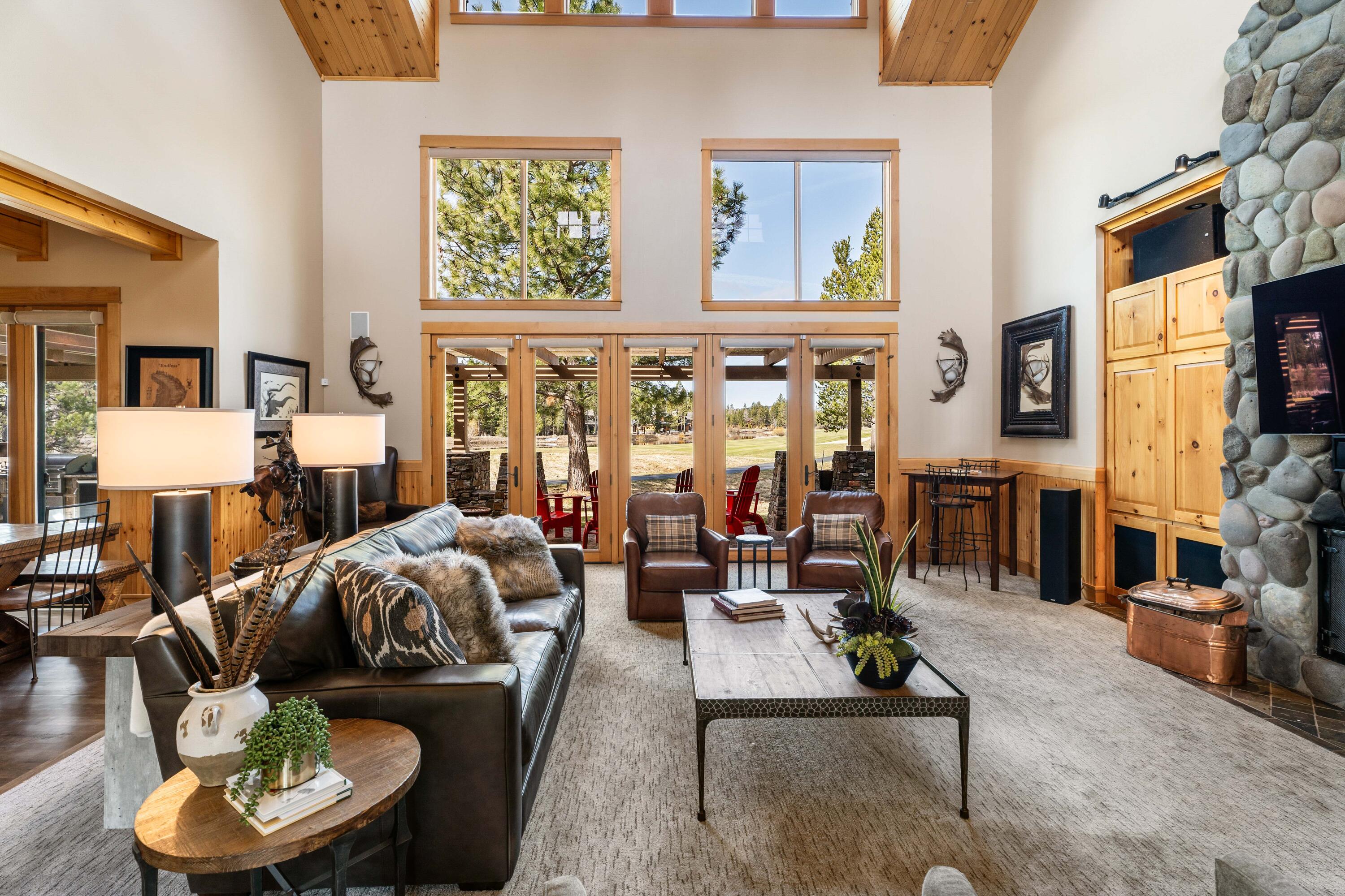 Stunning golf course & water views, located behind the gates of Crosswater! Situated on a large .80 acre lot on the 12 fairway, this home offers privacy, luxury & spectacular views creating the perfect golf/mountain retreat. Open floorplan w/ main level living, highlighted by expansive wood windows throughout that frame the views. The large gourmet kitchen is equipped with high-end appliances & a substantial wet bar, seamlessly connecting to the great room which features a wood-burning fireplace & vaulted wood ceilings, making it ideal for entertaining & outdoor living. The main level also hosts a primary suite w/ a cozy gas fireplace and en-suite bathroom w/ jetted tub, heated floors & walk-in shower.  The spacious mud/laundry room leads to a 3 car garage. Wonderful outdoor living space overlooking the golf course featuring an large covered area, gas fireplace, water feature, built-in barbecue & hot tub. Sold furnished. Start making memories in this special Crosswater home!