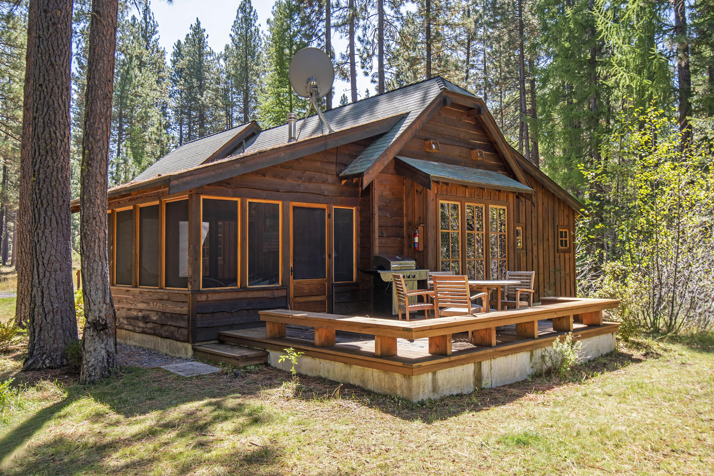 Experience a 1/4 share interest in a stunning 3 bedroom, 3 bathroom cabin at historic Lake Creek Lodge in Camp Sherman. This property beautifully combines modern amenities with the charm of yesteryear. Constructed in 2011, it is tastefully furnished with a blend of antiques & quality reproductions. The interior features fir plank floors, knotty pine paneling, & stone fireplace. The kitchen is equipped with butcher block countertops, a gas cooktop & farmhouse sink. Additional highlights include tile flooring & showers in the bathrooms, cedar decks, stone exterior accents, & secure storage. A beautifully appointed screened porch provides year-round comfort, offering views of the Lake Creek riparian area. The Shared Ownership Program manages maintenance, while amenities encompass a Lodge with a game rm, pool, tennis/pickleball courts, fly fishing pond, & trails. Recreational opportunities are plentiful including nearby golf, skiing & world-class fly fishing on the Metolius River.