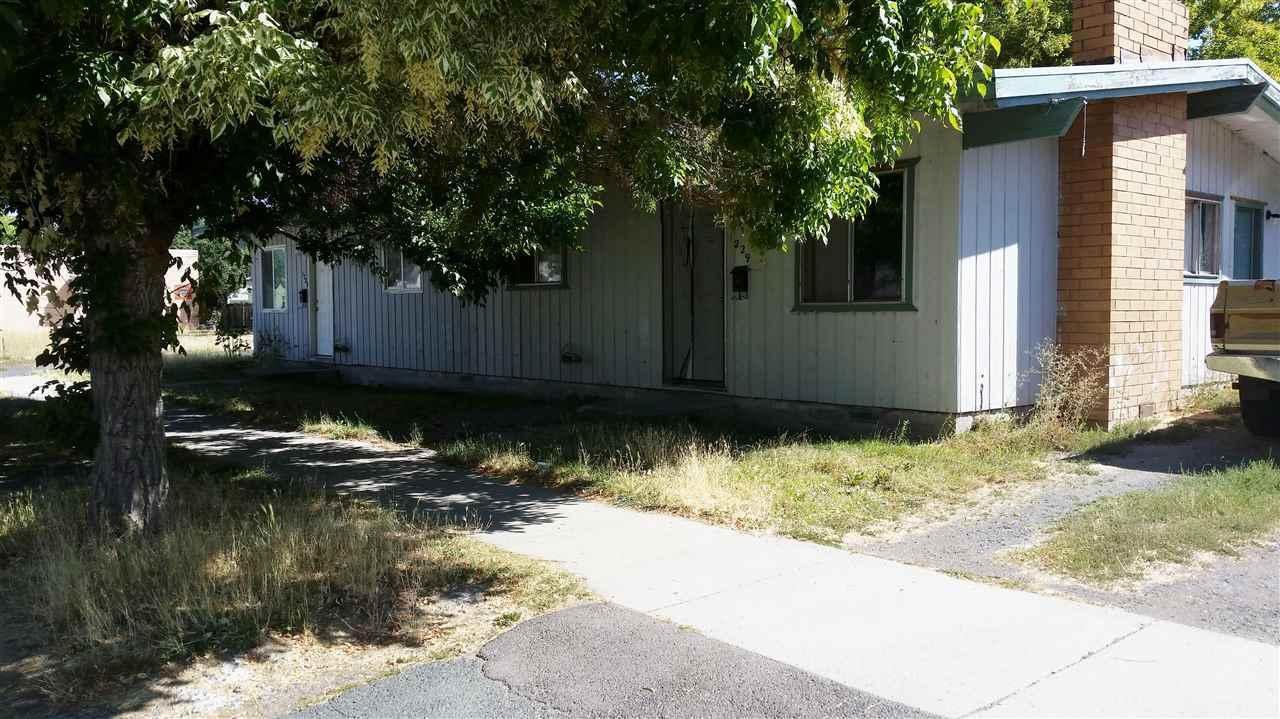 One duplex and one single family house on the corner of Division and Eberlein. All rented.