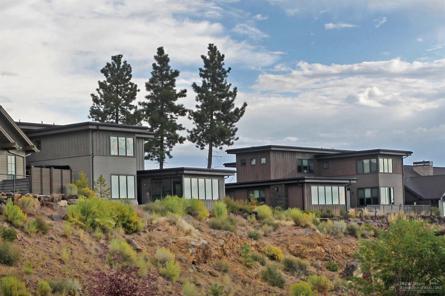 Perfectly situated near the resort's amenities and some of the best trails in Central OR, these income-producing vacation homes at Cairn allow you to take advantage of the Tetherow lifestyle. Wherever your travels take you, Cairn allows you to begin any adventure without venturing far. A typical day here includes a morning latte at the cafe, a swim and soak at Tetherow Sport, a round of golf, or a quick bike ride to Phil's Trail. When the day's over, head to The Row or Solomon's for a sunset dinner with Cascade views. This new Highlands Ridge floorplan is a fully turn-key 3,195 Sq Ft home w/ attached 2 car garage that features 5 Suites, modern and stylish finishes, a fire pit perfect for s'mores & memory making, rear courtyard, hot tub, and spectacular golf & mountain views. Not all inventory is actively listed in the MLS. Contact an agent to learn what else is available w/these income producing homes or to learn more! Photos of similar floor plan.<br>
