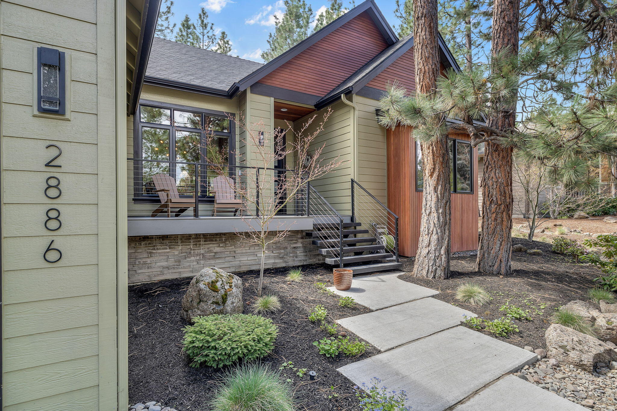 Come enjoy the indoor outdoor living of this beautifully updated home on the 9th fairway in the desirable community of Awbrey Glen! You will appreciate the attention to detail the owners took when remodeling the interior and exterior of this single level open concept living home. This better than new home features hardwood floors throughout. Gourmet kitchen with granite countertops, stainless steel appliances, and custom cabinets. Great room with dual sliders, and a stacked stone fireplace, great for those snowy days.  Spacious primary suite with dual vanities, soaking tub, tile shower, and private deck with hot tub. Enjoy the expansive covered back patio great for entertaining and relaxation all with a golf course view.