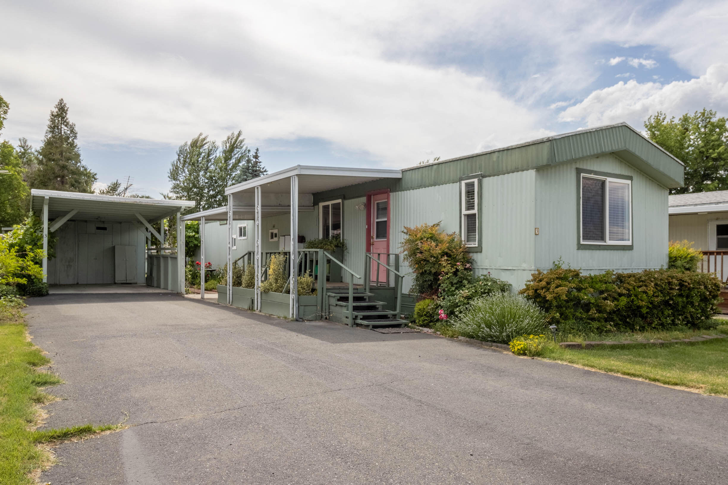 Welcome home to this cute and clean home in a quiet and small senior park! The home has been well cared for, including a lifetime, metal roof new in 2011 and then recoated in 2022. The range/oven, washer, dryer, and heat pump were all new in 2014. With 924 square feet and 2 bed/1 bath, the home is comfortable and includes a large pantry/laundry room, as well as a second pantry and extra storage in the hallway! Outside, the owners have lovingly cared for the grounds with pretty landscaping and even grape vines. There are also two sheds for extra storage, office space, or gardening tools! Behind the home is a nice, well-kept, grassy area that separates the other 15 homes in the park. The location of the park is hard to beat, with easy nearby access to nearby transit service, as well as a short distance to shopping and Three Rivers Medical Center. The low space rent includes water, sewer and garbage. Schedule your showing today, before this little gem is gone! No Dogs, Indoor Cats Only.