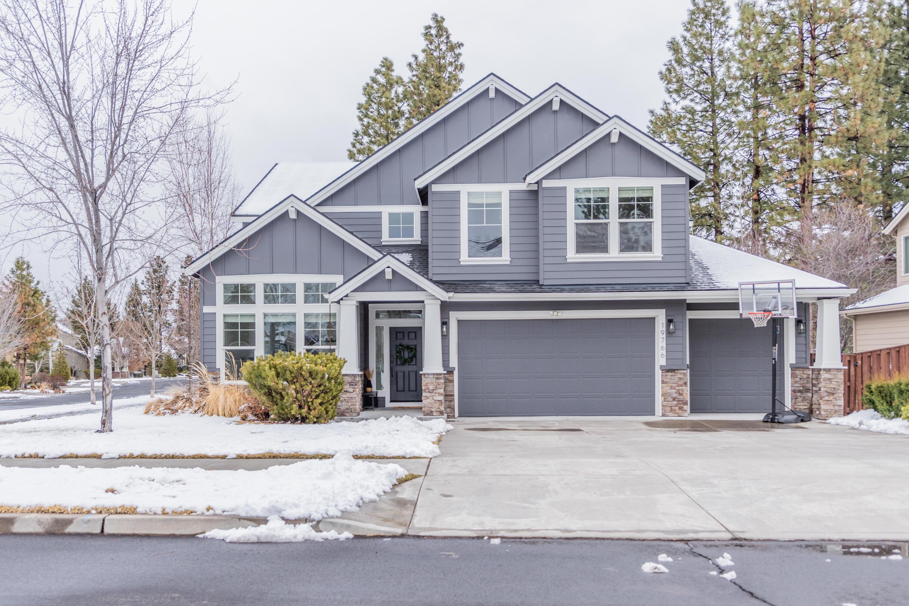 Stop your home search because this beauty checks all the boxes. This thoughtfully updated home in River Canyon Estates features wide plank, European white oak flooring that runs through the main level. New light fixtures, classy wainscoting, and a floor to ceiling paneled fireplace with white stone accents give the home a comfortable but upscale feel. The primary suite is situated off the family room and features a generous bathroom with a soaking tub, dual vanity, and spacious walk-in closet. Moving upstairs you are greeted by a vast open loft, oversized bonus room, and three additional bedrooms. But the real showstopper is this home's location. Situated on a corner lot, the home backs to a neighborhood greenbelt affectionately referred to as the pit. Sledding and snowball fights in the winter, baseball and slip n' slides in the summer. Not to be overlooked, the neighborhood has direct access to the iconic Deschutes River trail, offers a community clubhouse, fitness center, and pool.