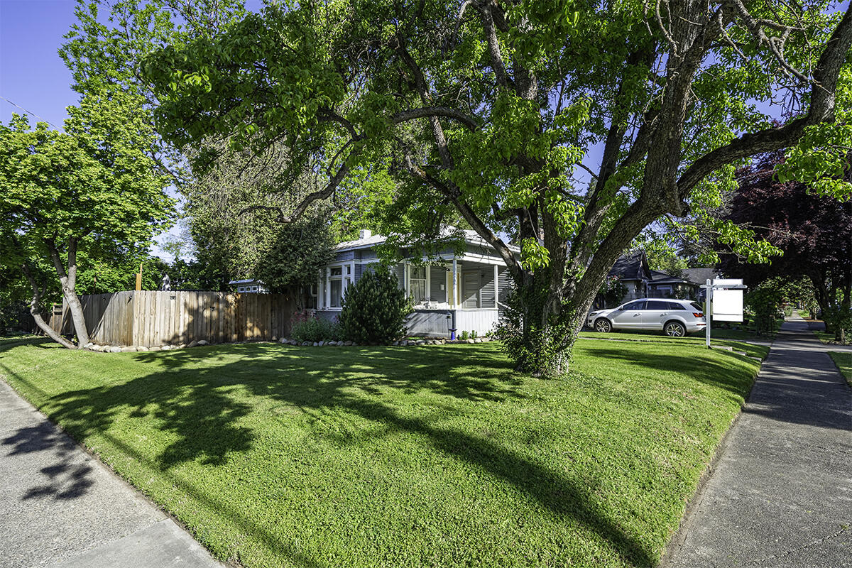 **Charming 1910 Cottage in Old East Medford - Modern Updates with Art Studio & Large Lot** Welcome to the perfect blend of historic charm and modern convenience in this tastefully updated 1910 cottage in old East Medford. This unique property offers a comfortable retreat with a spacious bedroom complete with built-in closet as well as a small sitting room, nursery, or additional closet space. Once inside, you'll find a peaceful & inviting interior that tastefully integrates modern updates with original features. The living area combines comfort and style, perfect for both relaxing and entertaining. Situated on a generously sized lot, this property provides ample space for gardening, outdoor activities, RV parking, and has an adorable Art Studio that can serve as a workshop, home office, or oversized shed. Enjoy the beautiful outdoor seating area, complete with a fire pit. This tranquil setting is great for gatherings, star-gazing, or simply enjoying quiet moments.